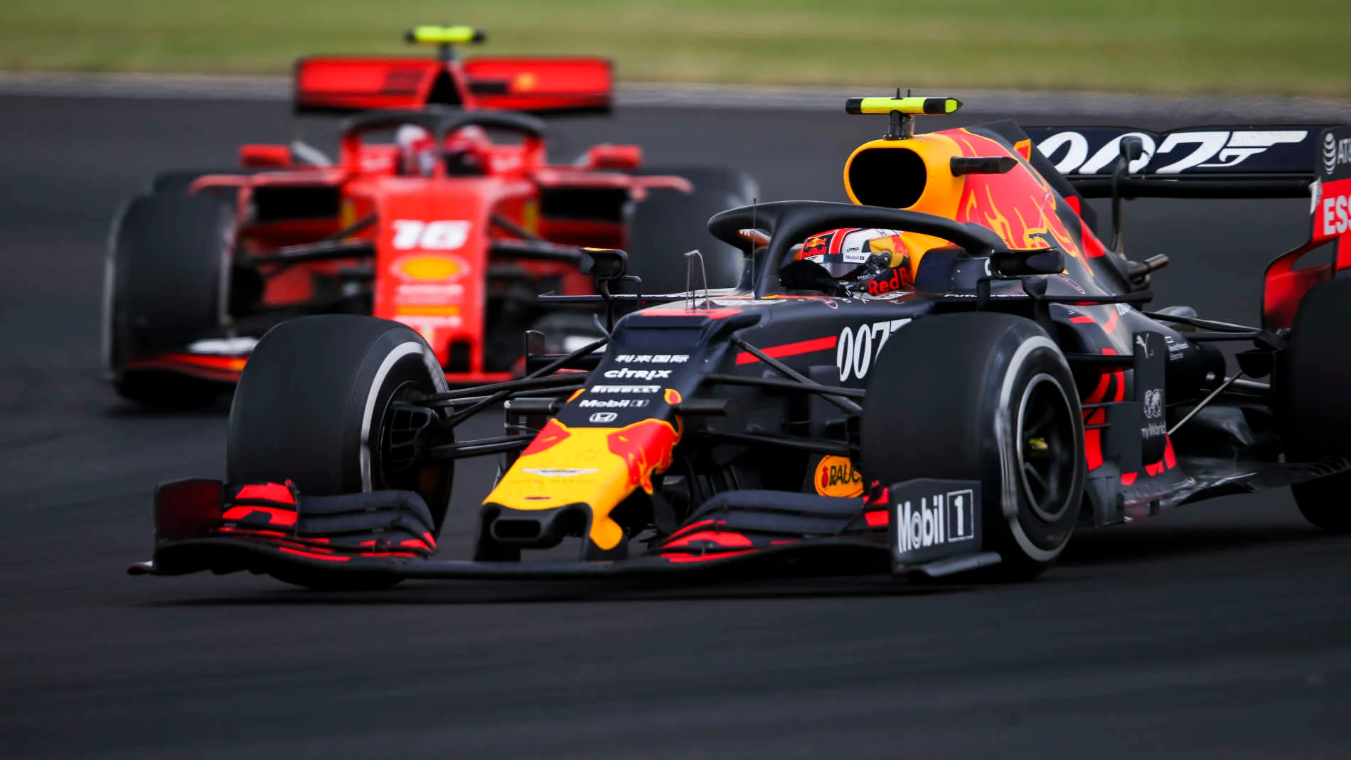 SILVERSTONE, UNITED KINGDOM - JULY 14: Pierre Gasly, Red Bull Racing RB15, leads Charles Leclerc,