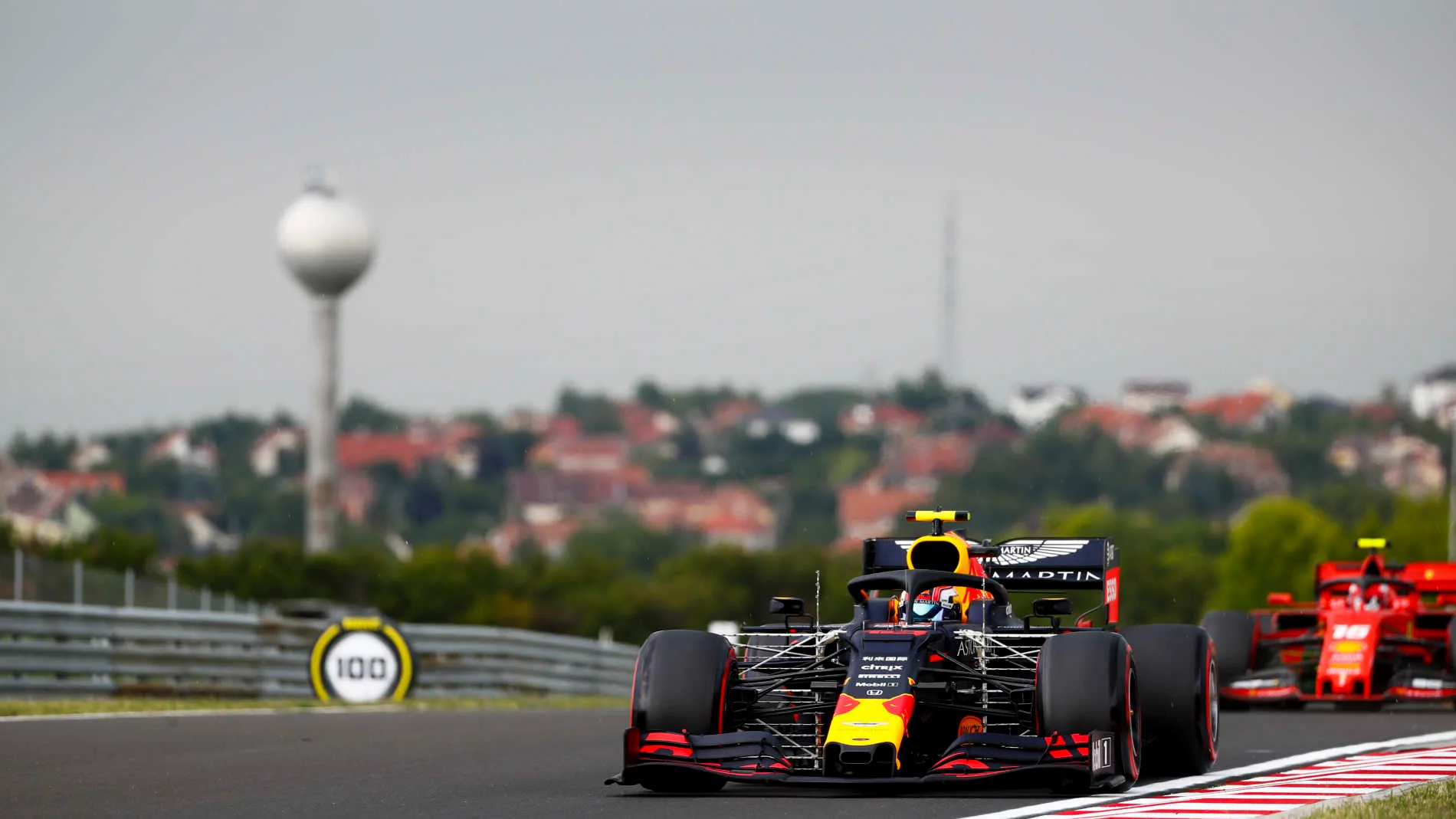 HUNGARORING, HUNGARY - AUGUST 02: Pierre Gasly, Red Bull Racing RB15, leads Charles Leclerc,