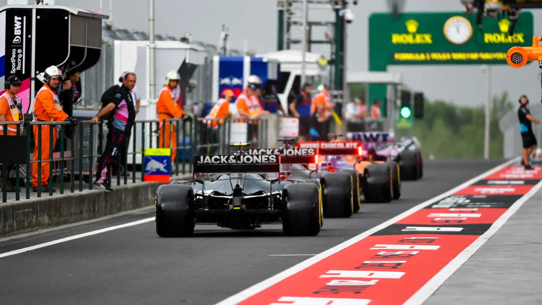 HUNGARORING, HUNGARY - AUGUST 02: Romain Grosjean, Haas VF-19, and Kevin Magnussen, Haas VF-19,