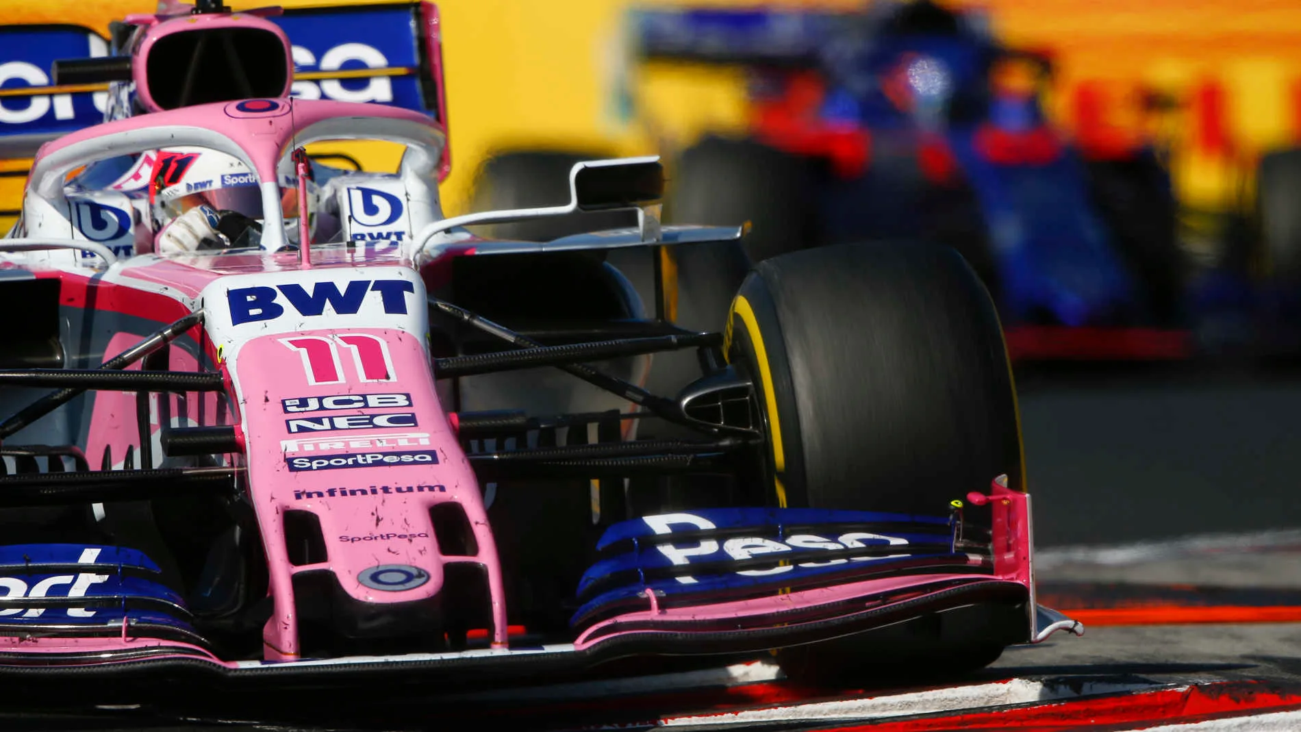 HUNGARORING, HUNGARY - AUGUST 04: Sergio Perez, Racing Point RP19, leads Alexander Albon, Toro