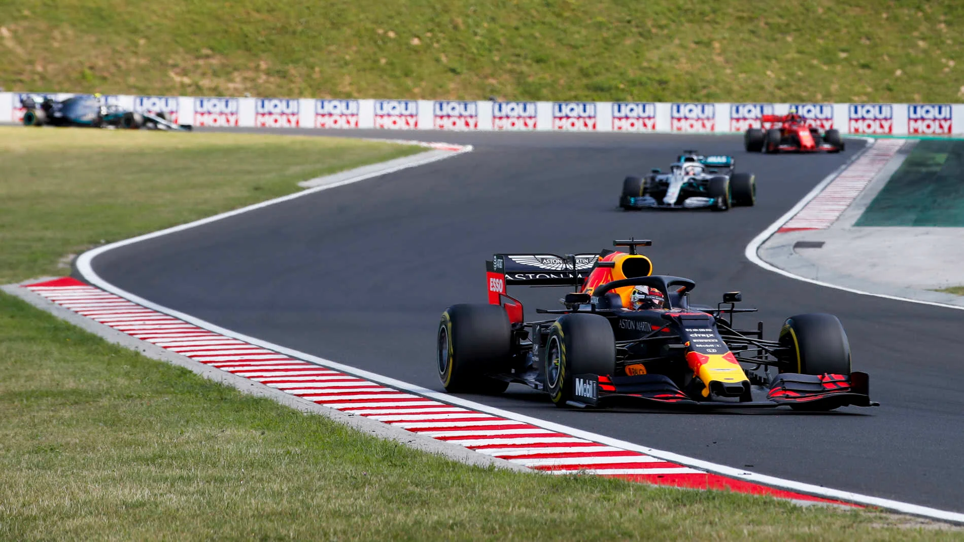 HUNGARORING, HUNGARY - AUGUST 04: Max Verstappen, Red Bull Racing RB15, leads Lewis Hamilton,