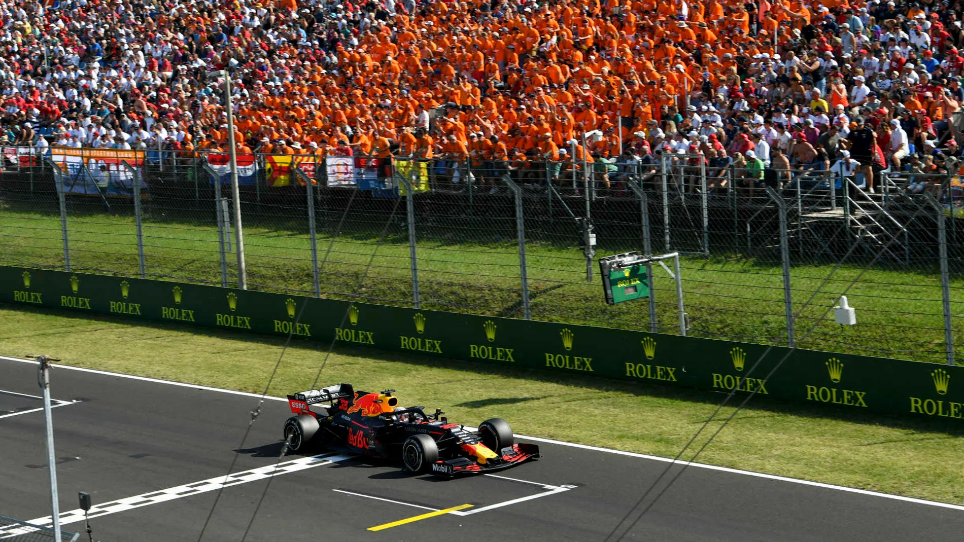 HUNGARORING, HUNGARY - AUGUST 04: Max Verstappen, Red Bull Racing RB15 passes fans during the