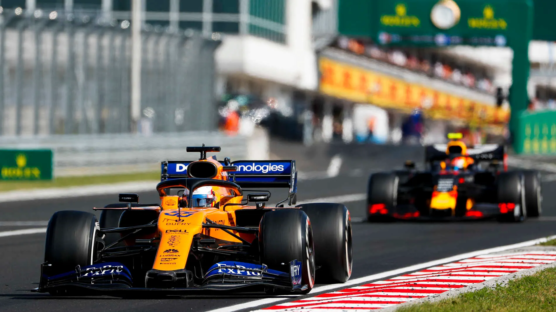 HUNGARORING, HUNGARY - AUGUST 04: Carlos Sainz Jr., McLaren MCL34, leads Pierre Gasly, Red Bull