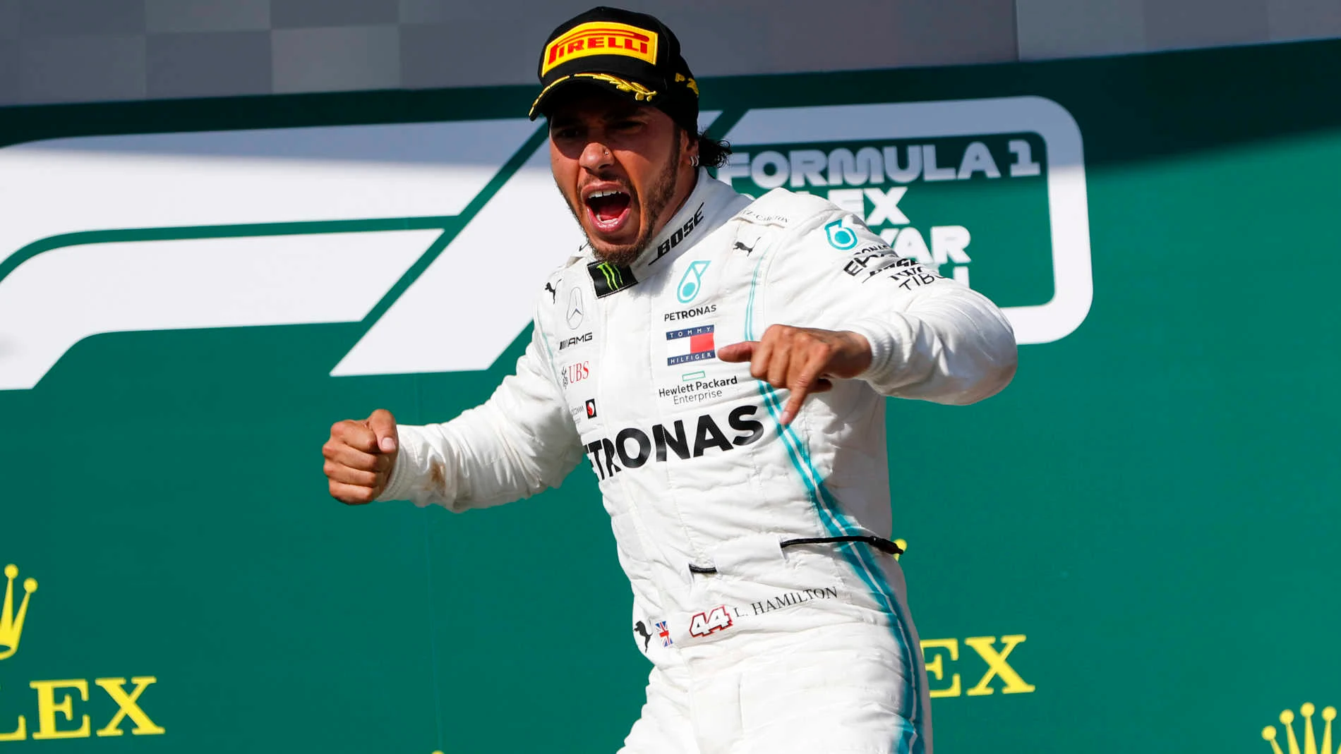 HUNGARORING, HUNGARY - AUGUST 04: Lewis Hamilton, Mercedes AMG F1, 1st position, arrives on the podium during the Hungarian GP at Hungaroring on August 04, 2019 in Hungaroring, Hungary. (Photo by Zak Mauger / LAT Images)