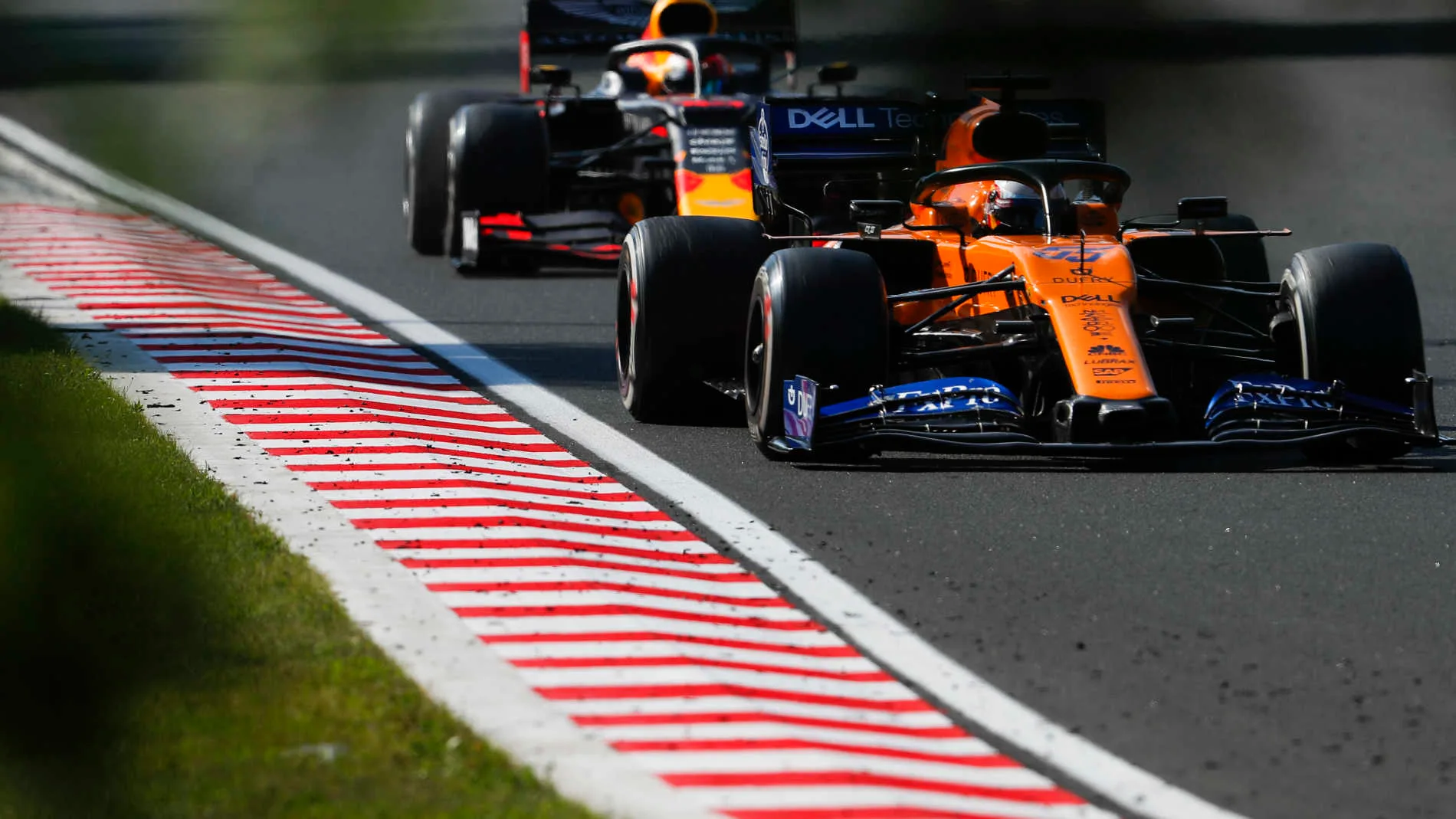 HUNGARORING, HUNGARY - AUGUST 04: Carlos Sainz Jr., McLaren MCL34, leads Pierre Gasly, Red Bull