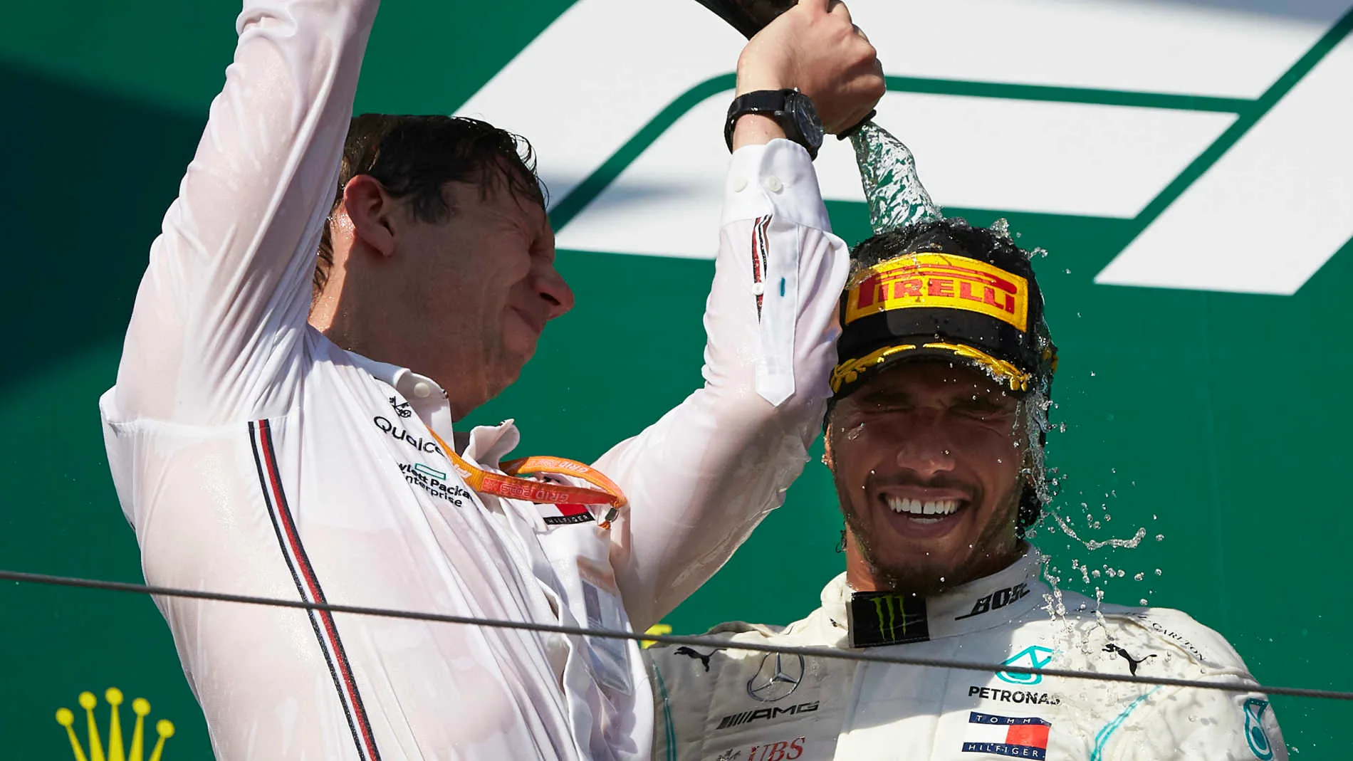 HUNGARORING, HUNGARY - AUGUST 04: Matt Deane, Chief Mechanic, Mercedes AMG, pours Champagne over