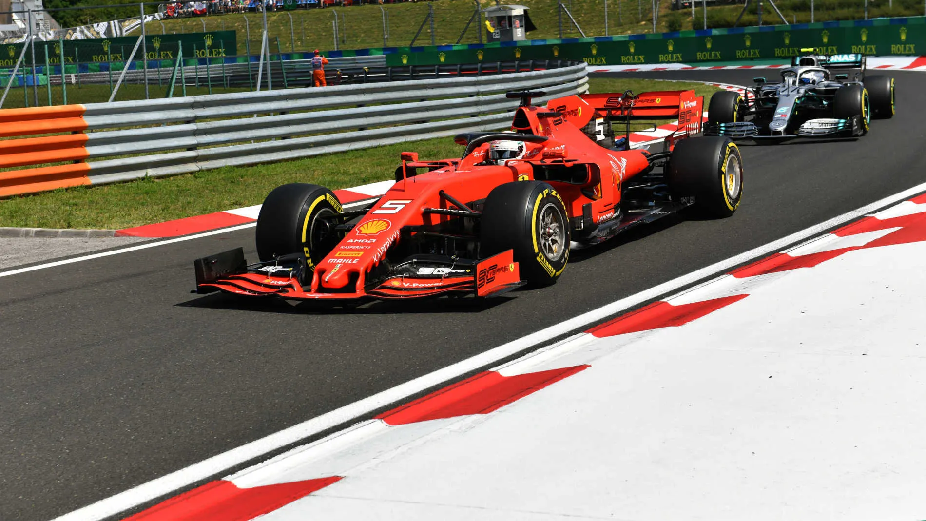 HUNGARORING, HUNGARY - AUGUST 04: Sebastian Vettel, Ferrari SF90, leads Valtteri Bottas, Mercedes
