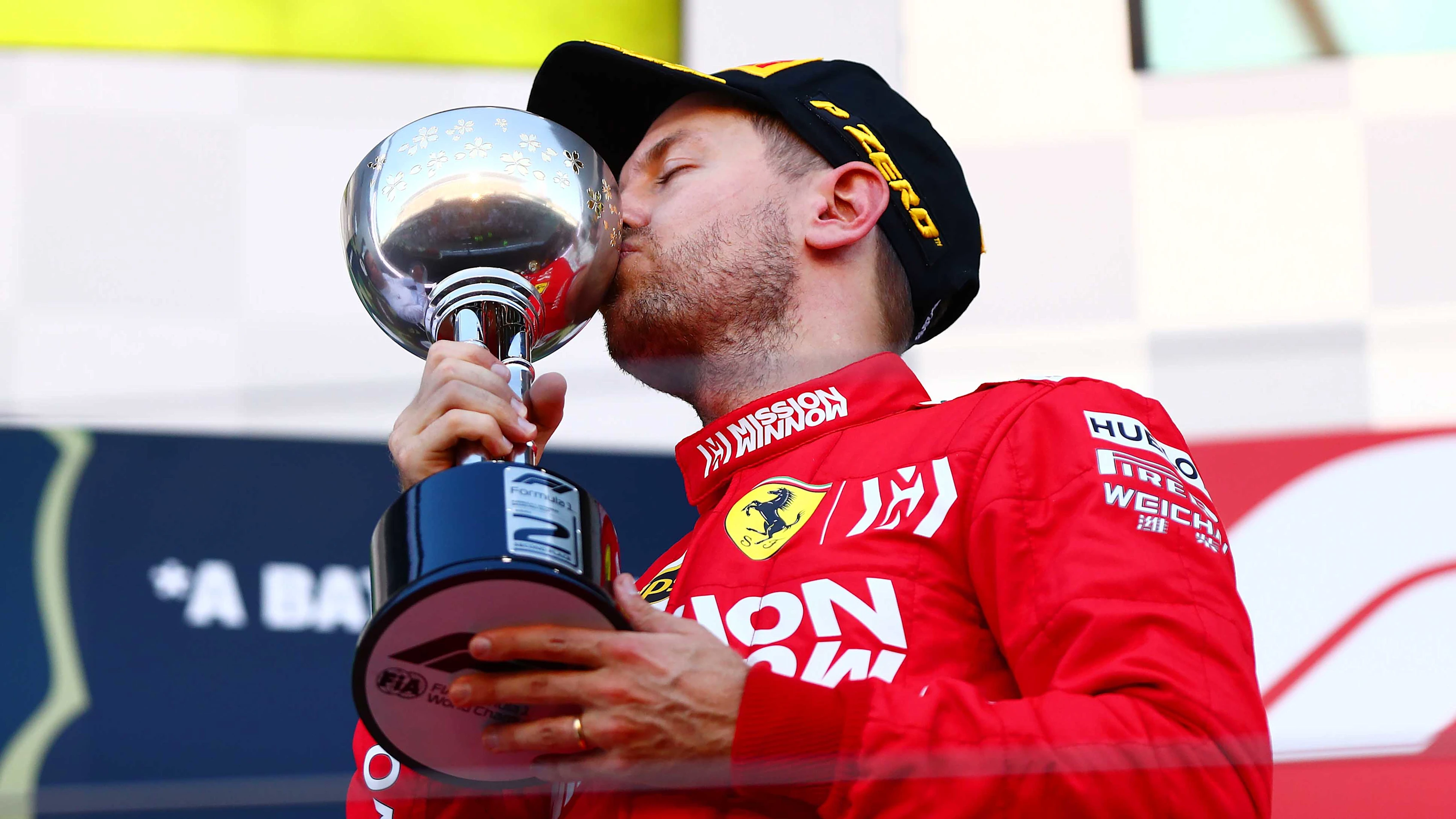SUZUKA, JAPAN - OCTOBER 13: Second placed Sebastian Vettel of Germany and Ferrari celebrates on the