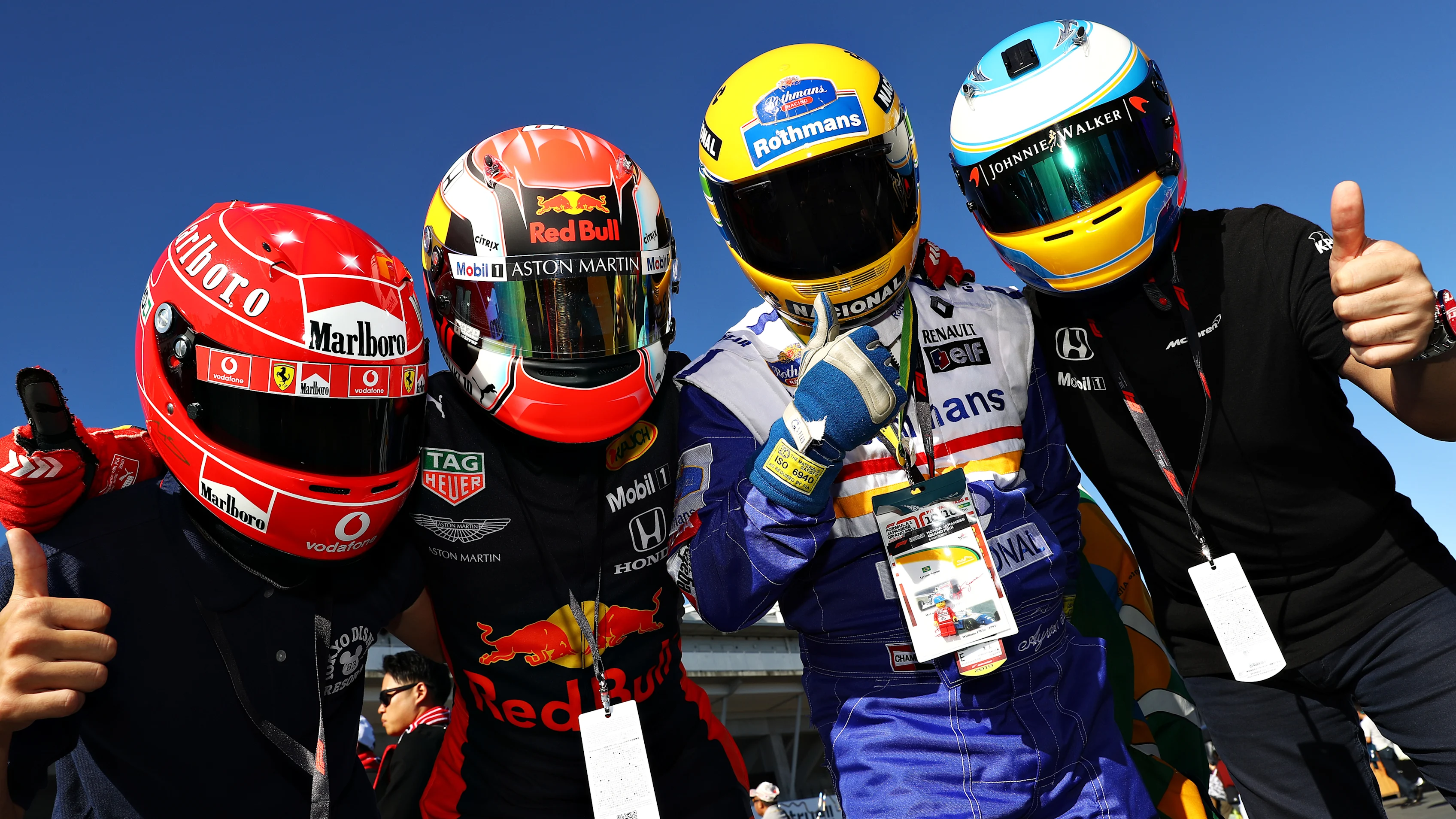 SUZUKA, JAPAN - OCTOBER 13: Ferrari, Red Bull Racing, Williams and McLaren fans show their support