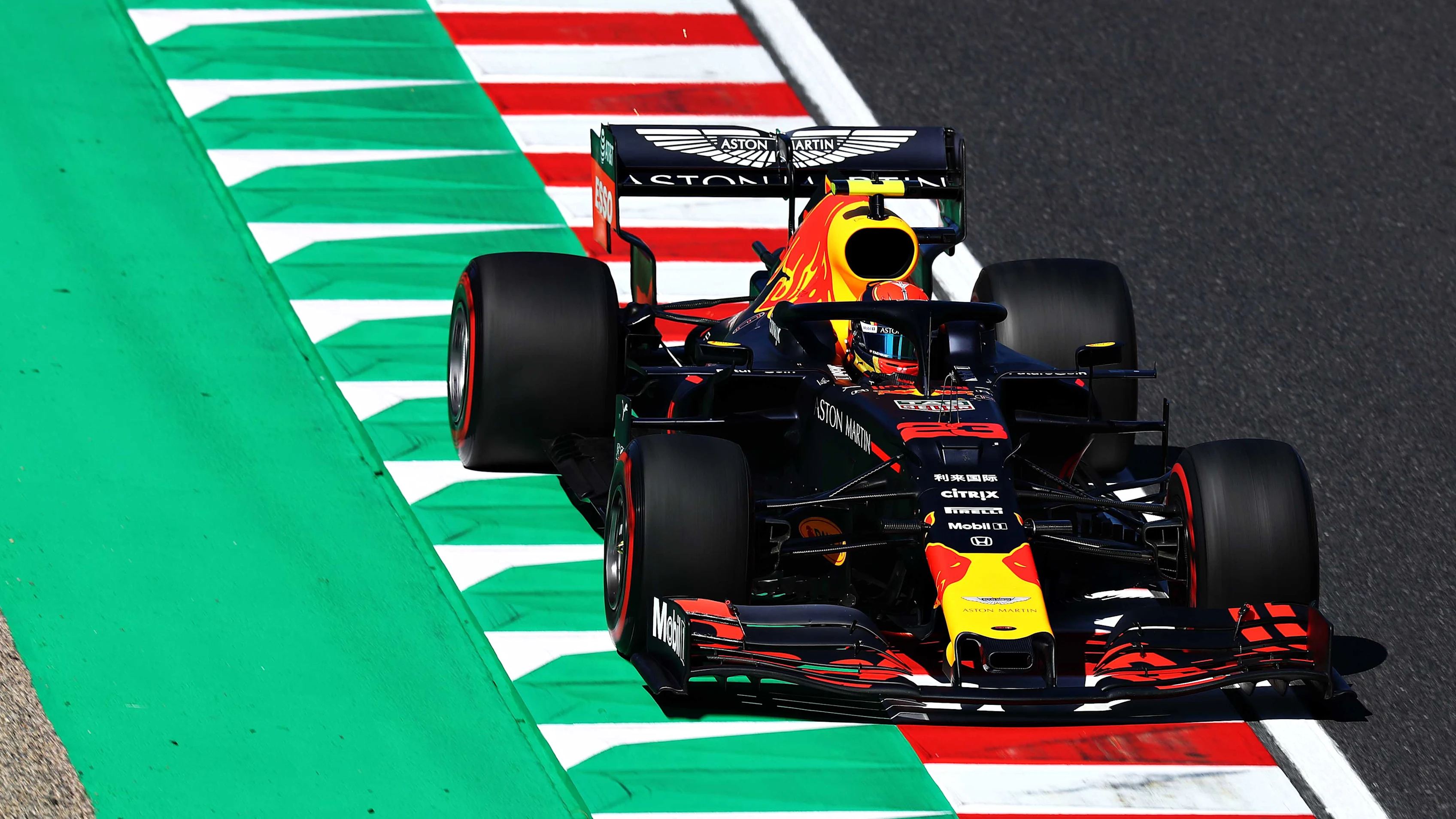 SUZUKA, JAPAN - OCTOBER 13: Alexander Albon of Thailand driving the (23) Aston Martin Red Bull