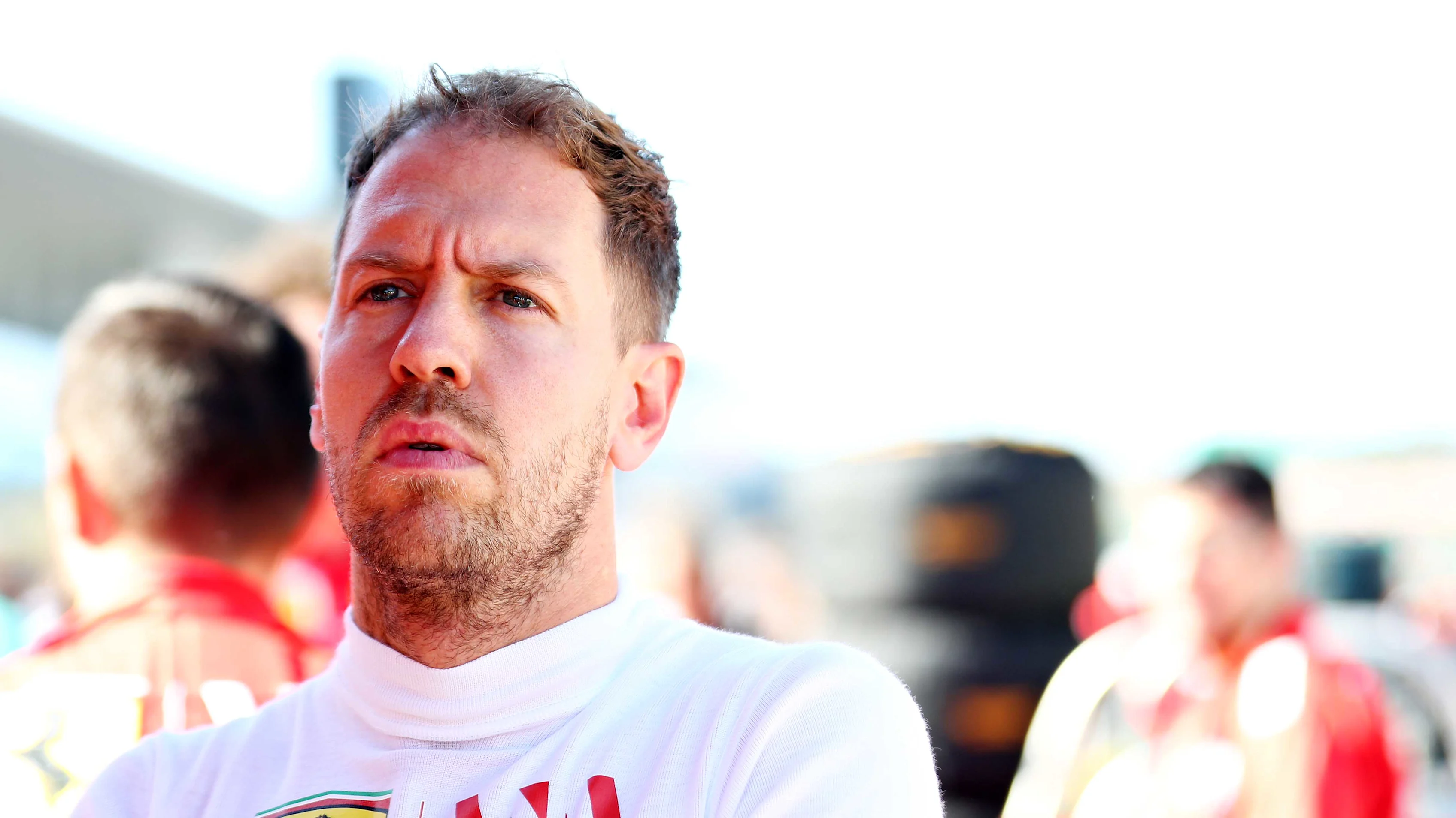 SUZUKA, JAPAN - OCTOBER 13: Sebastian Vettel of Germany and Ferrari prepares to drive on the grid