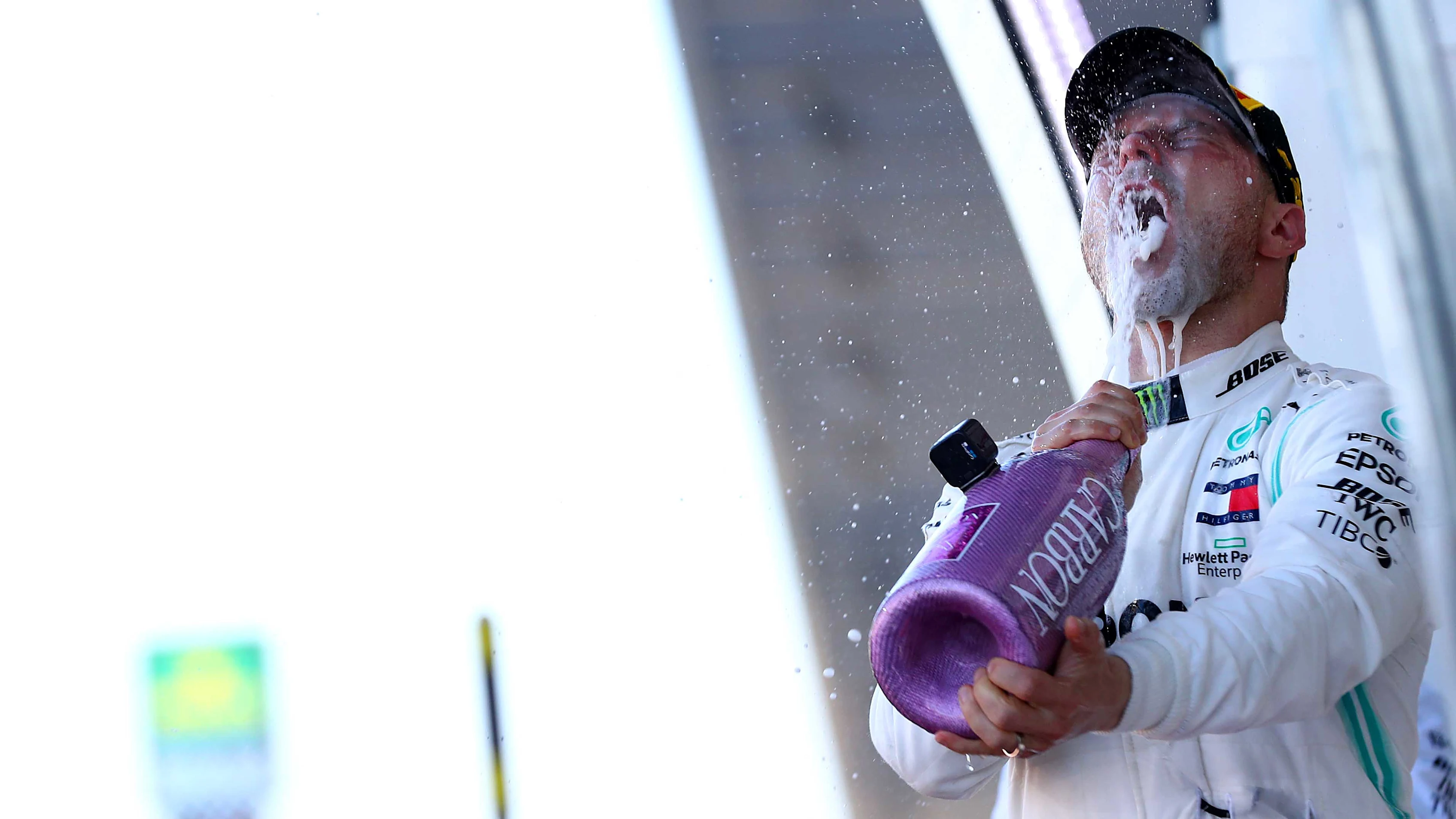 SUZUKA, JAPAN - OCTOBER 13: Race winner Valtteri Bottas of Finland and Mercedes GP celebrates on