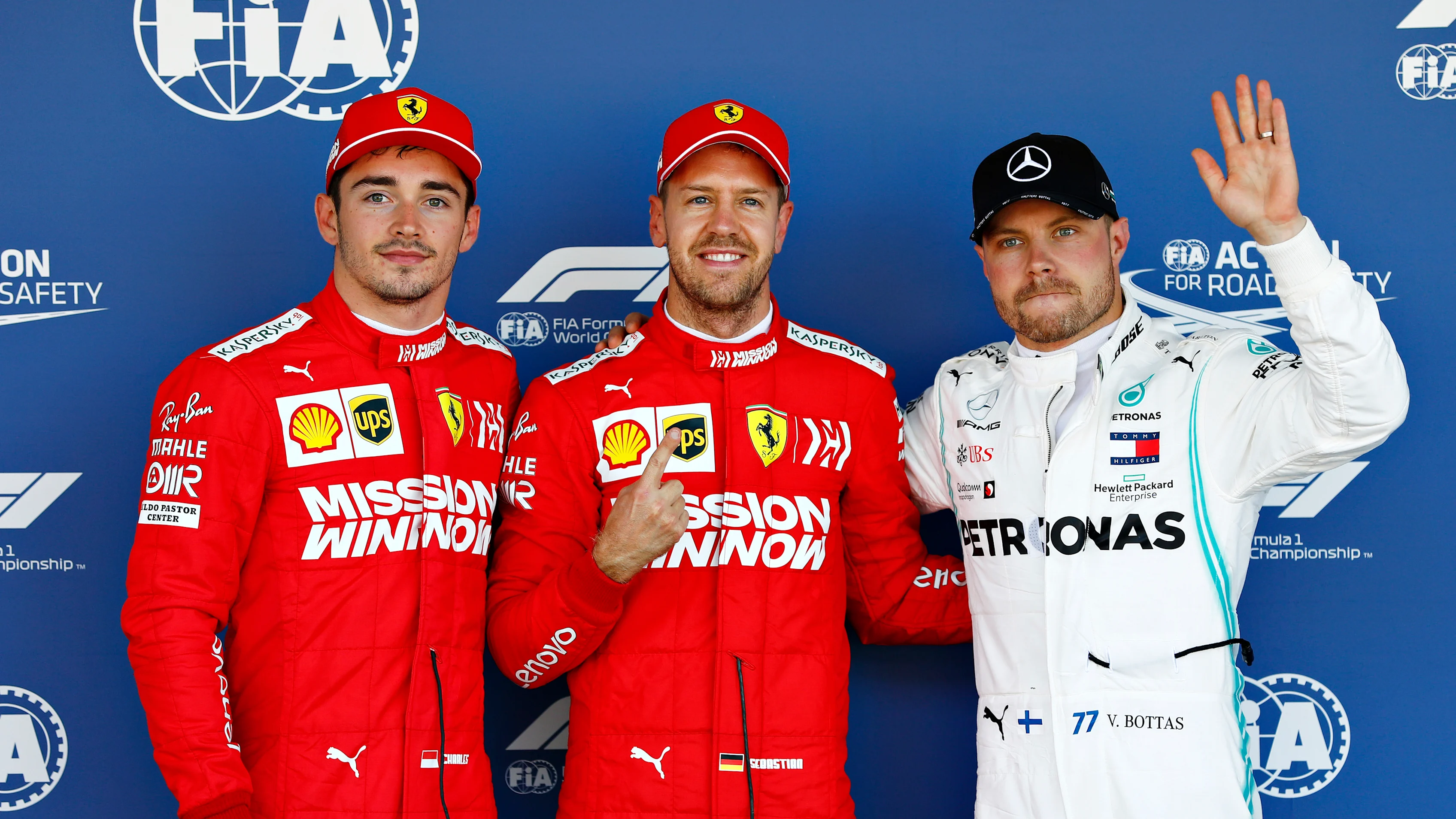SUZUKA, JAPAN - OCTOBER 13: Top three qualifiers Sebastian Vettel of Germany and Ferrari, Charles