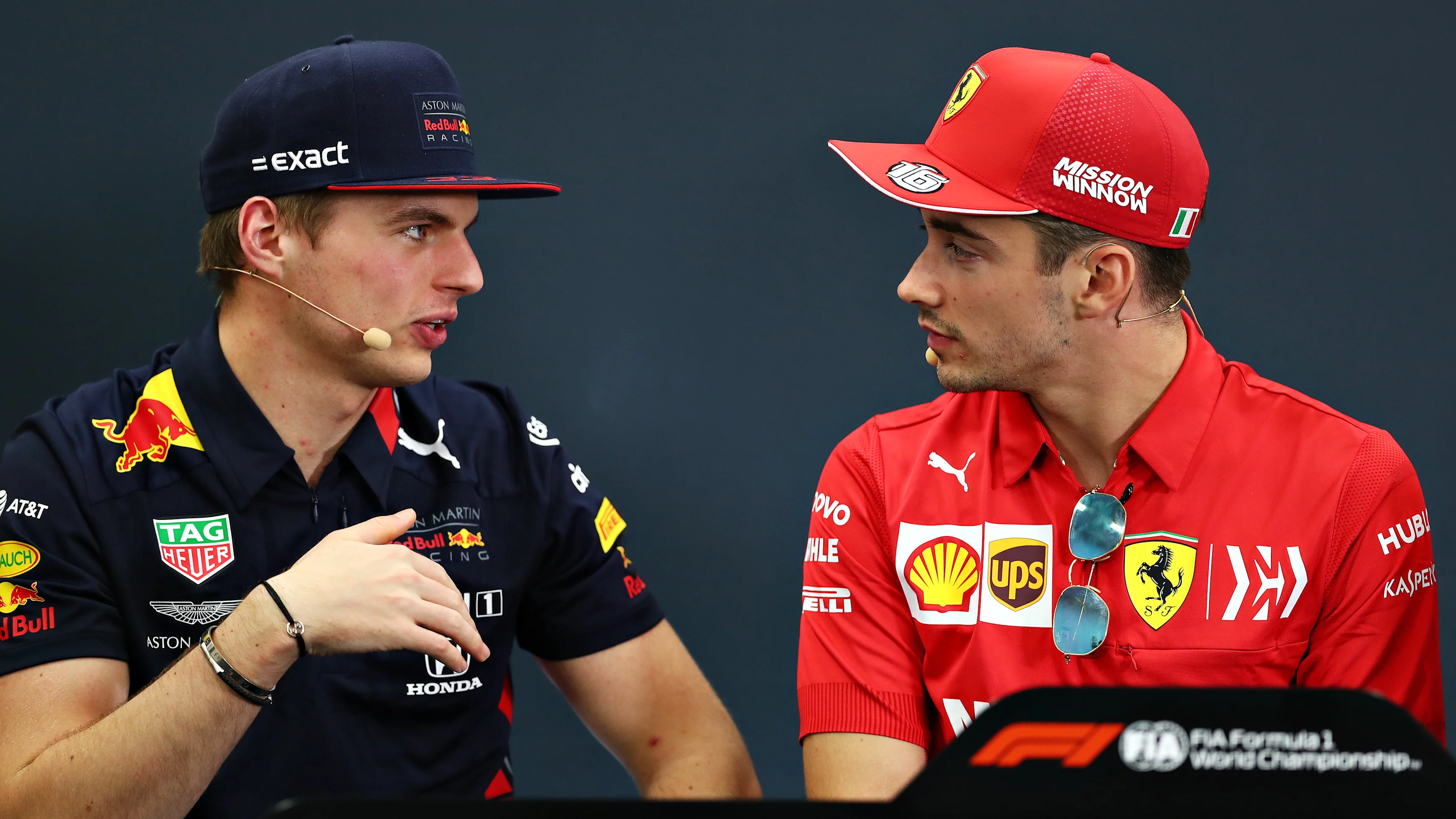 SUZUKA, JAPAN - OCTOBER 10: Max Verstappen of Netherlands and Red Bull Racing and Charles Leclerc