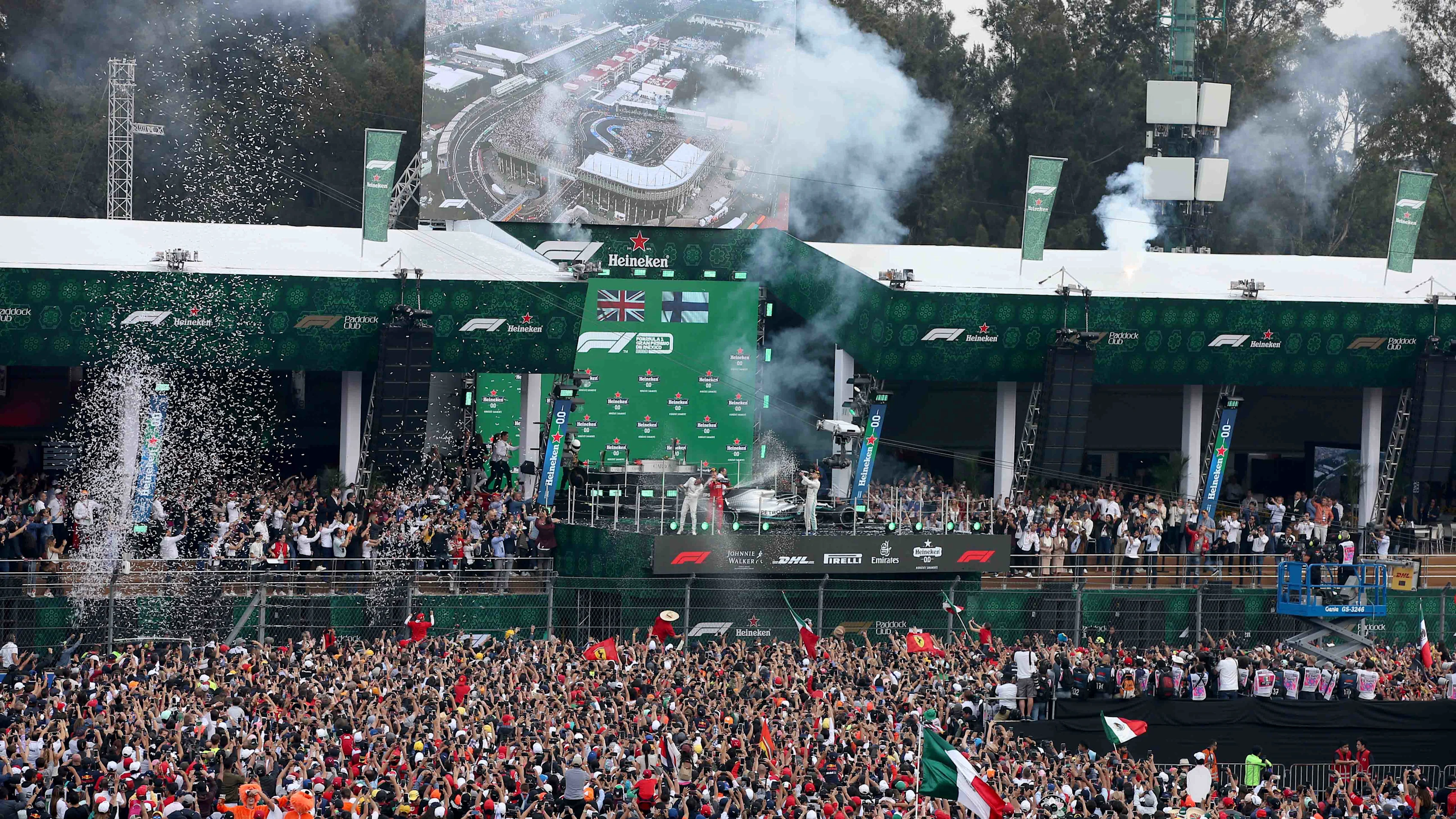 MEXICO CITY, MEXICO - OCTOBER 27: A general view as race winner Lewis Hamilton of Great Britain and Mercedes GP, second placed Sebastian Vettel of Germany and Ferrari and third placed Valtteri Bottas of Finland and Mercedes GP celebrate on the podium during the F1 Grand Prix of Mexico at Autodromo Hermanos Rodriguez on October 27, 2019 in Mexico City, Mexico. (Photo by Charles Coates/Getty Images)