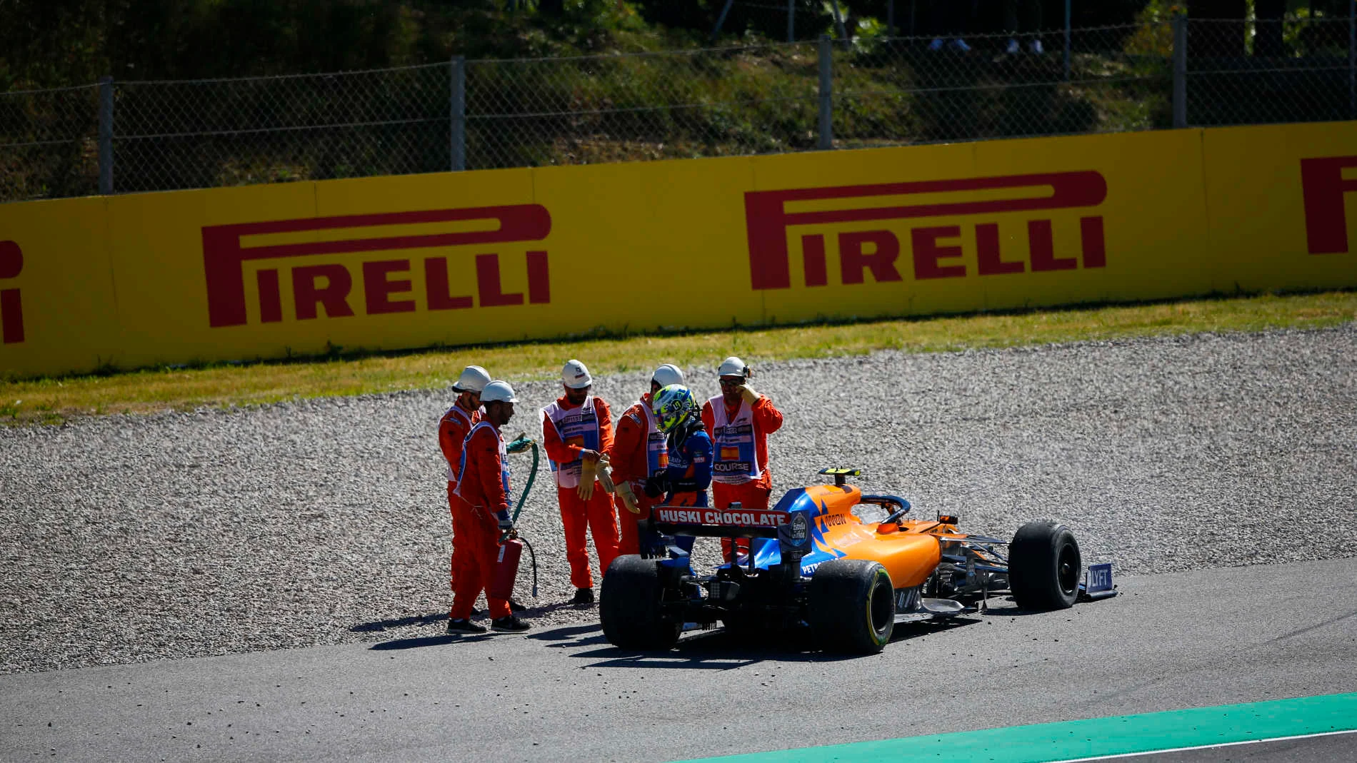 CIRCUIT DE BARCELONA-CATALUNYA, SPAIN - MAY 12: Marshals assist Lando Norris, McLaren MCL34, after