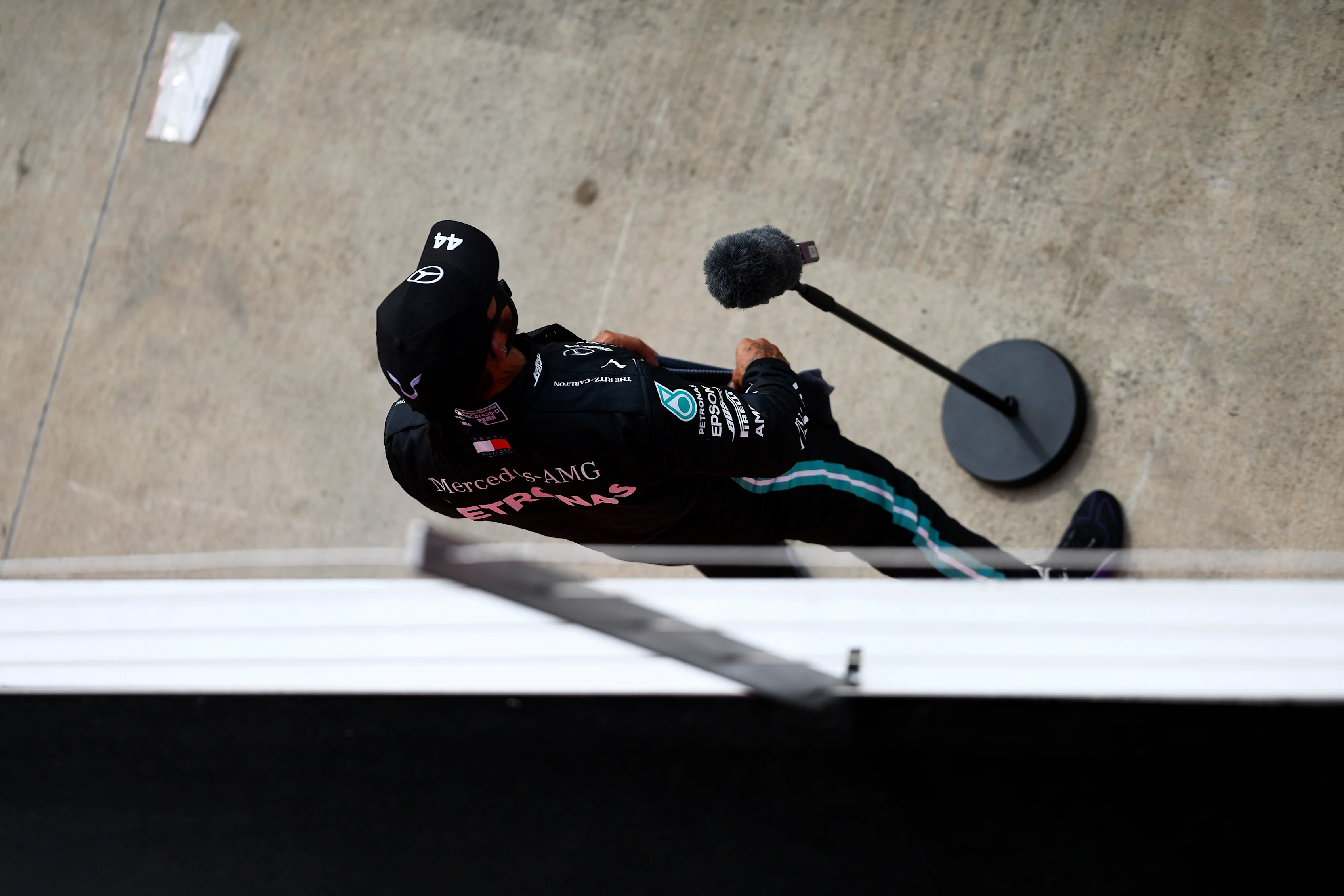 NORTHAMPTON, ENGLAND - AUGUST 08: Second placed qualifier Lewis Hamilton of Great Britain and Mercedes GP talks to the media in parc ferme during qualifying for the F1 70th Anniversary Grand Prix at Silverstone on August 08, 2020 in Northampton, England. (Photo by Rudy Carezzevoli/Getty Images)