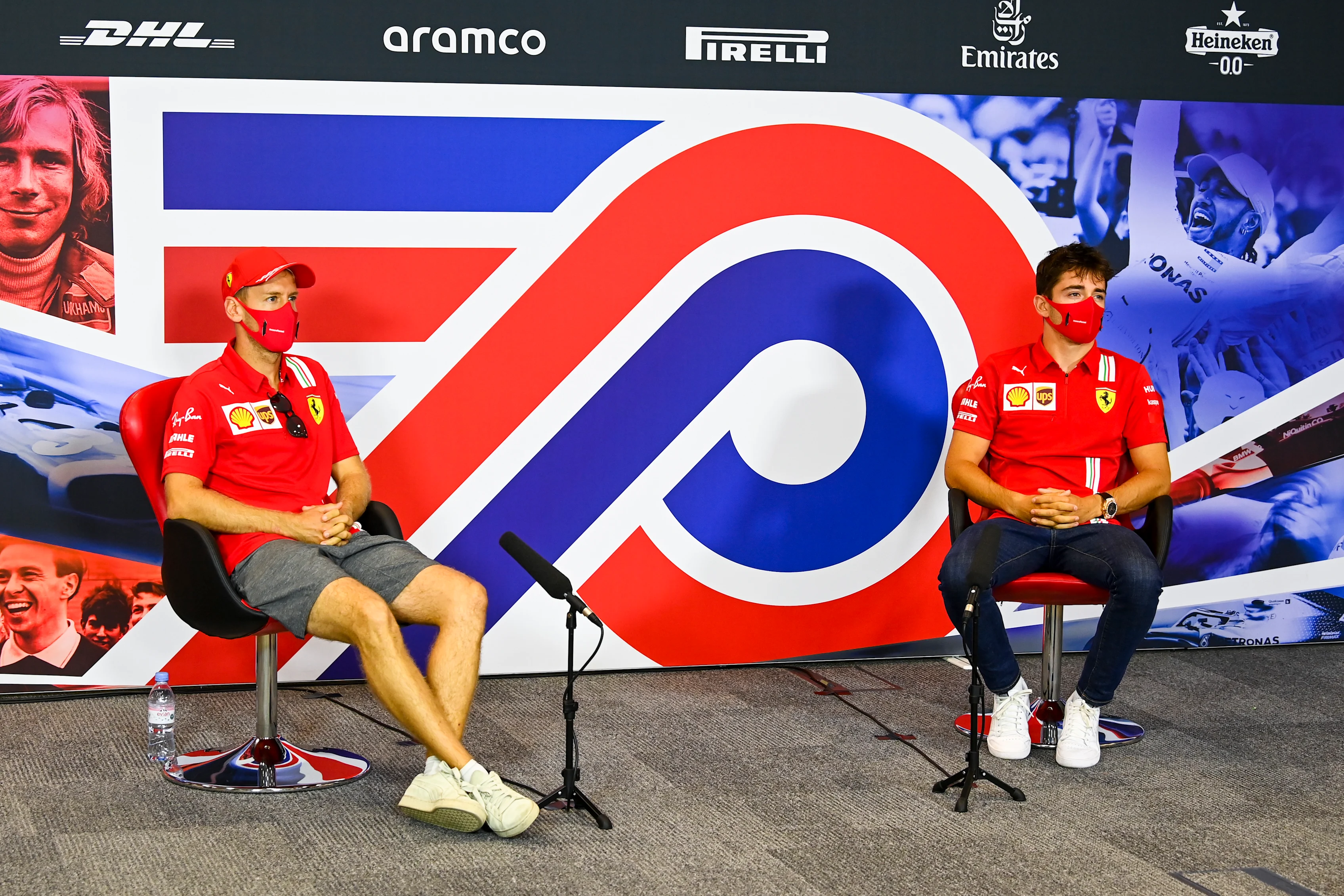 NORTHAMPTON, ENGLAND - AUGUST 06: Sebastian Vettel of Germany and Ferrari and Charles Leclerc of