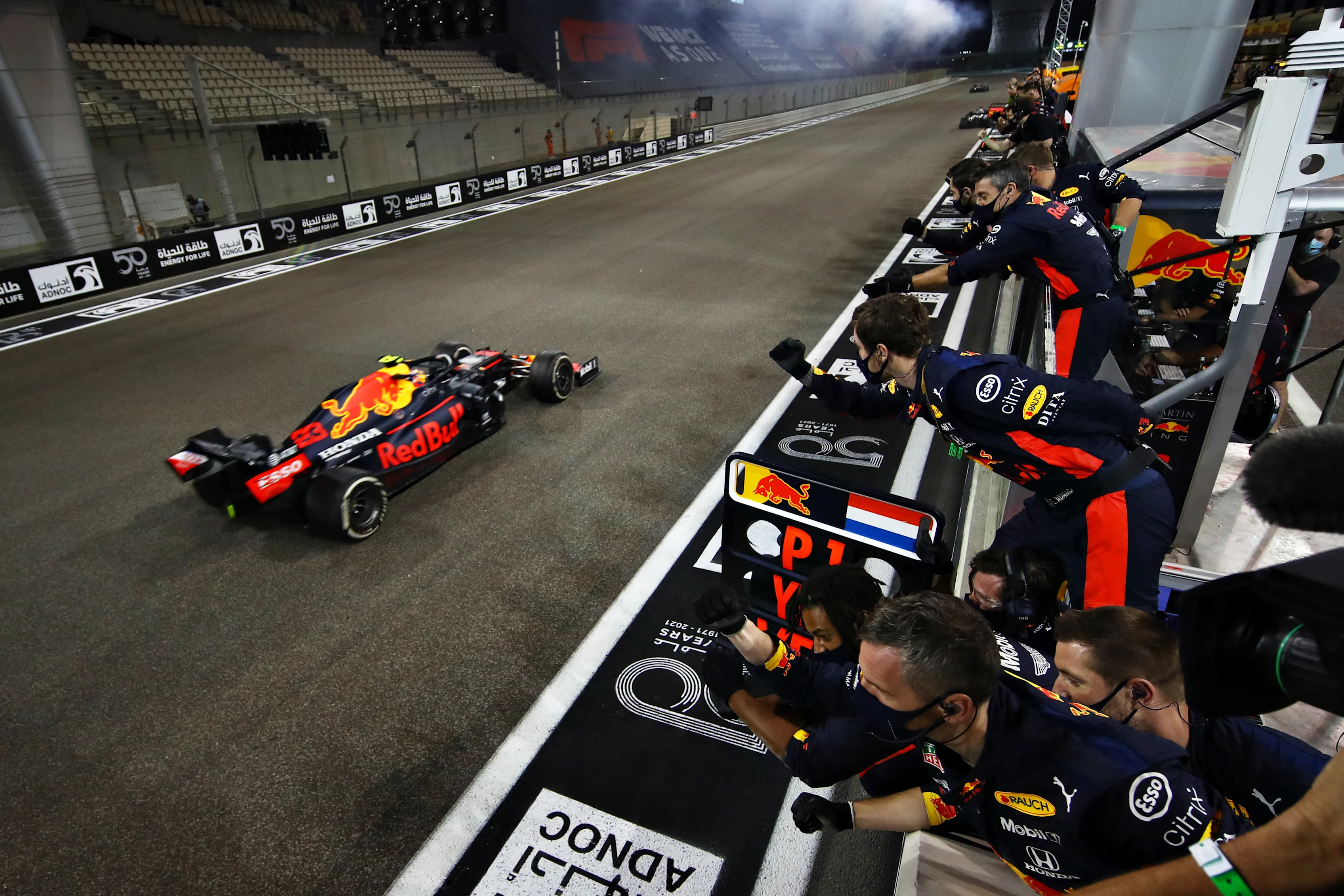 ABU DHABI, UNITED ARAB EMIRATES - DECEMBER 13: The Red Bull Racing team cheer as Alexander Albon of
