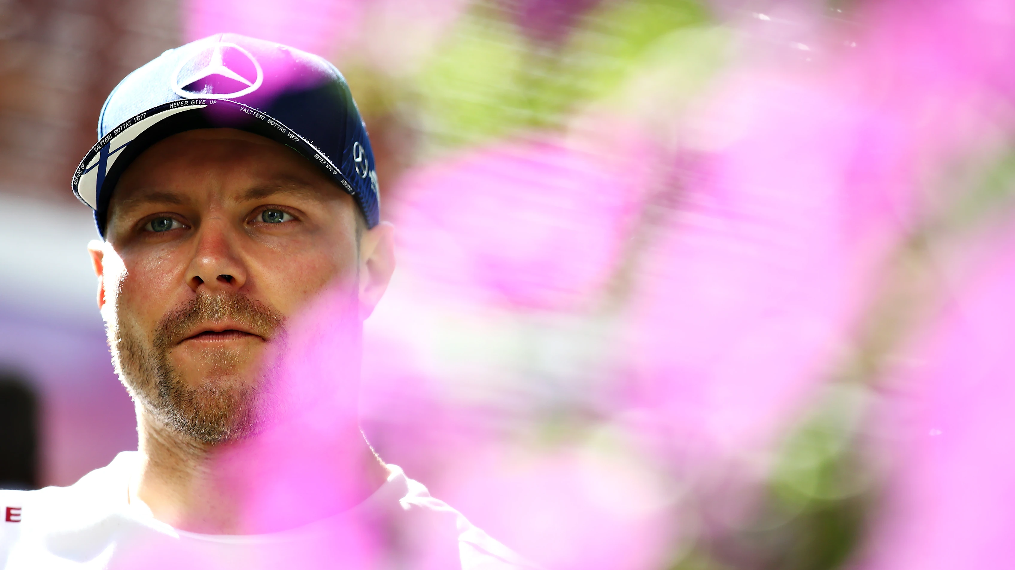 MELBOURNE, AUSTRALIA - MARCH 12: Valtteri Bottas of Finland and Mercedes GP looks on in the Paddock