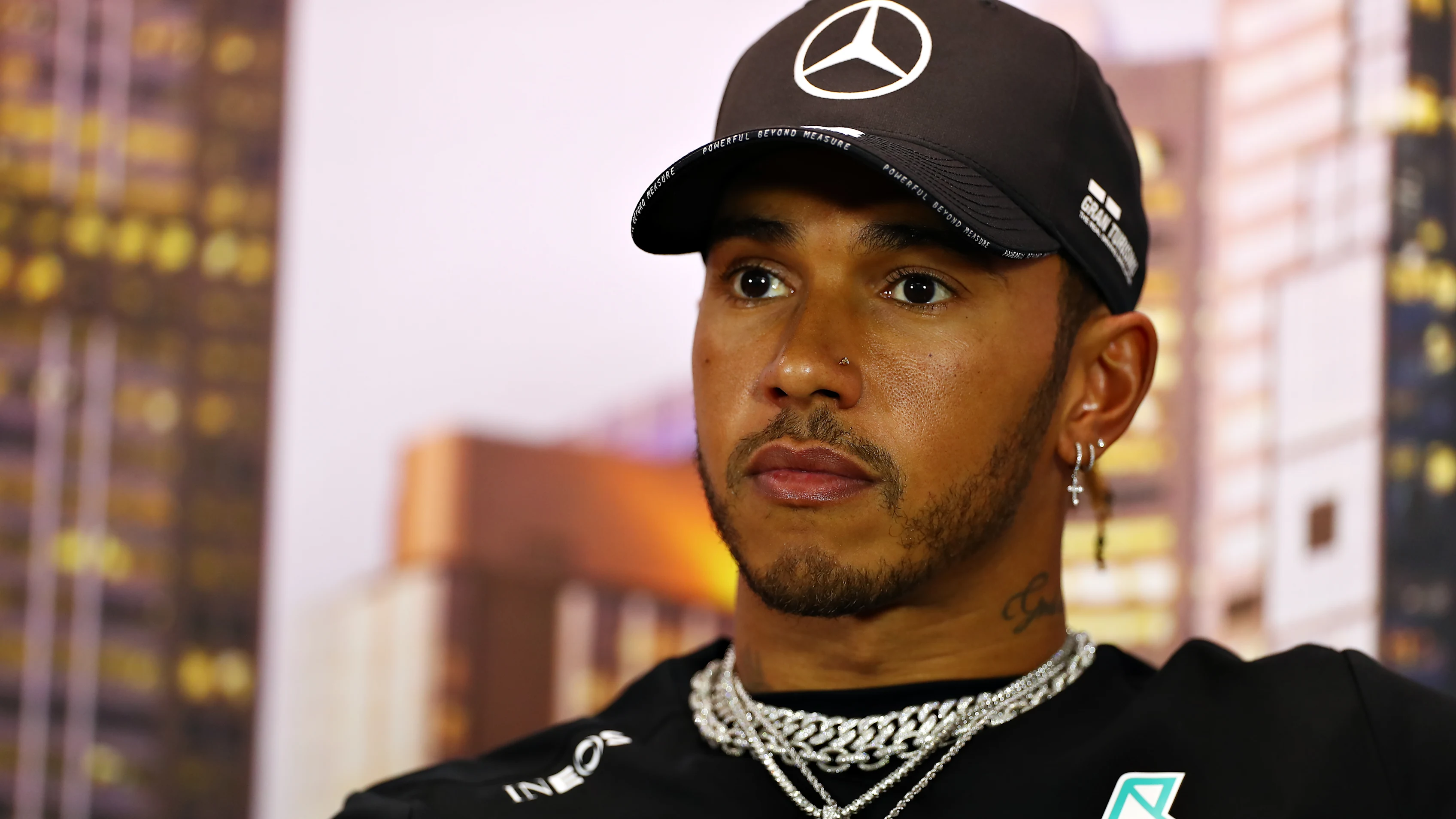 MELBOURNE, AUSTRALIA - MARCH 12: Lewis Hamilton of Great Britain and Mercedes GP talks in the