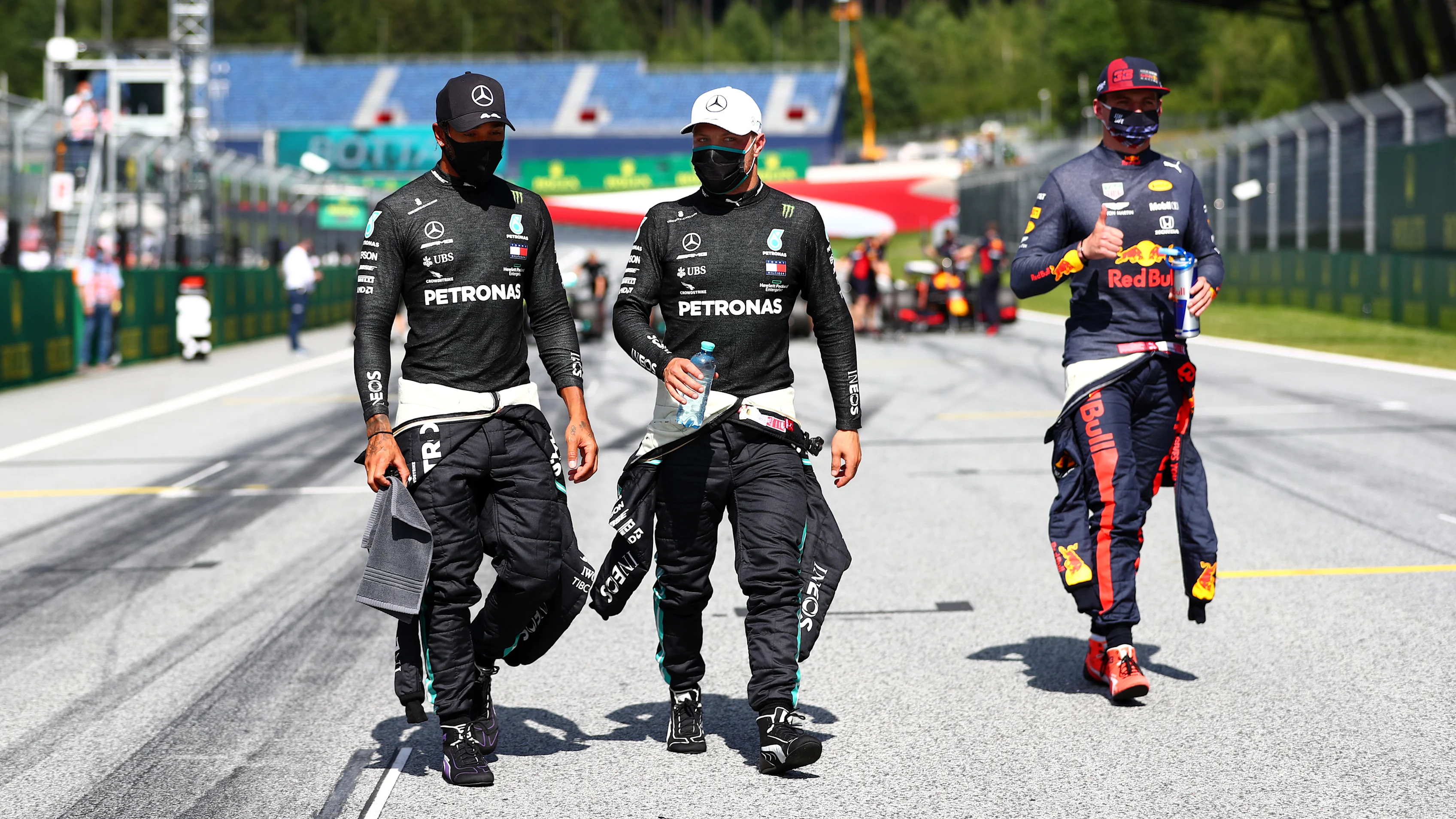 SPIELBERG, AUSTRIA - JULY 04: Lewis Hamilton of Great Britain and Mercedes GP talks with Valtteri