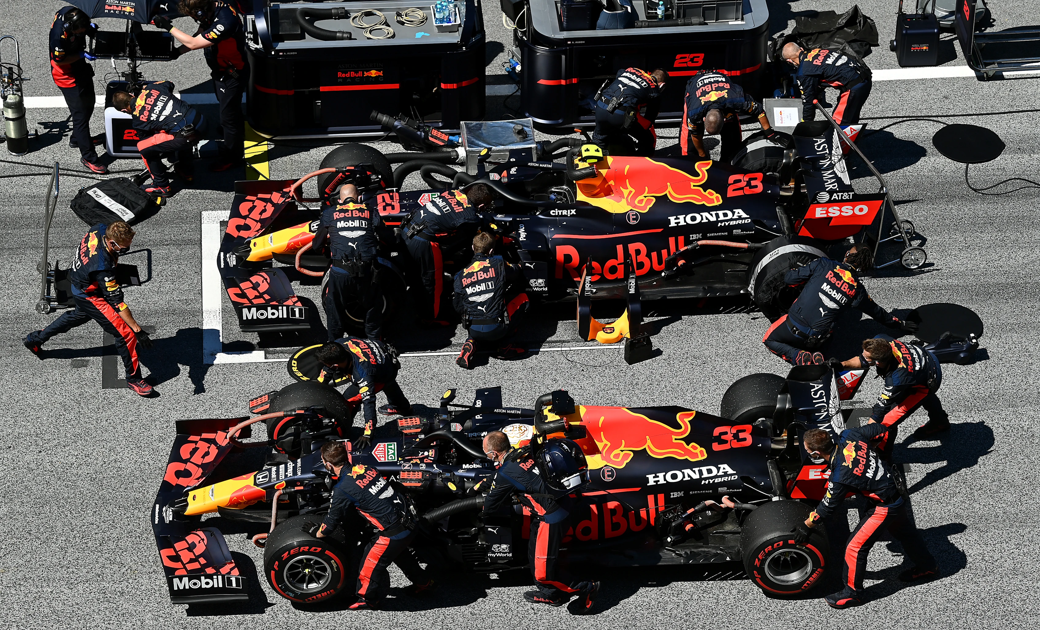SPIELBERG, AUSTRIA - JULY 05: Alexander Albon of Thailand driving the (23) Aston Martin Red Bull Racing RB16 and Max Verstappen of the Netherlands driving the (33) Aston Martin Red Bull Racing RB16 prepare on the grid during the Formula One Grand Prix of Austria at Red Bull Ring on July 05, 2020 in Spielberg, Austria. (Photo by Clive Mason - Formula 1/Formula 1 via Getty Images)