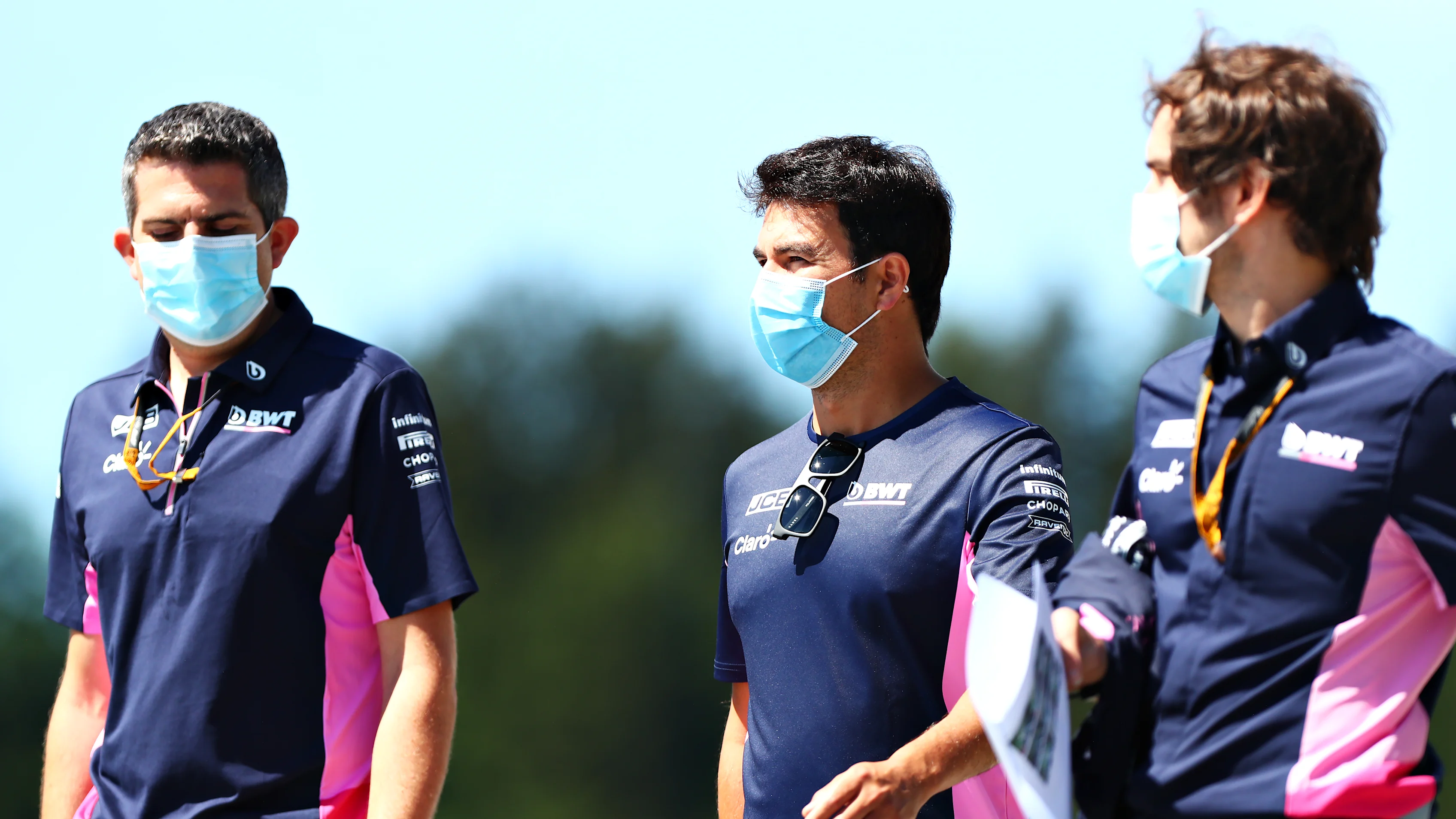 SPIELBERG, AUSTRIA - JULY 02: Sergio Perez of Mexico and Racing Point walks the track with his team
