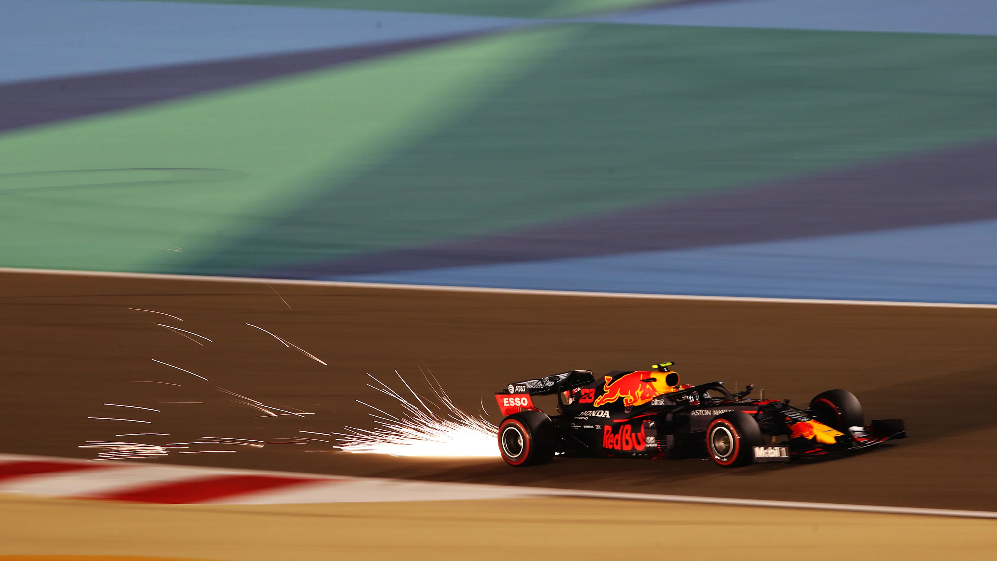 BAHRAIN, BAHRAIN - NOVEMBER 28: Sparks fly behind Alexander Albon of Thailand driving the (23)
