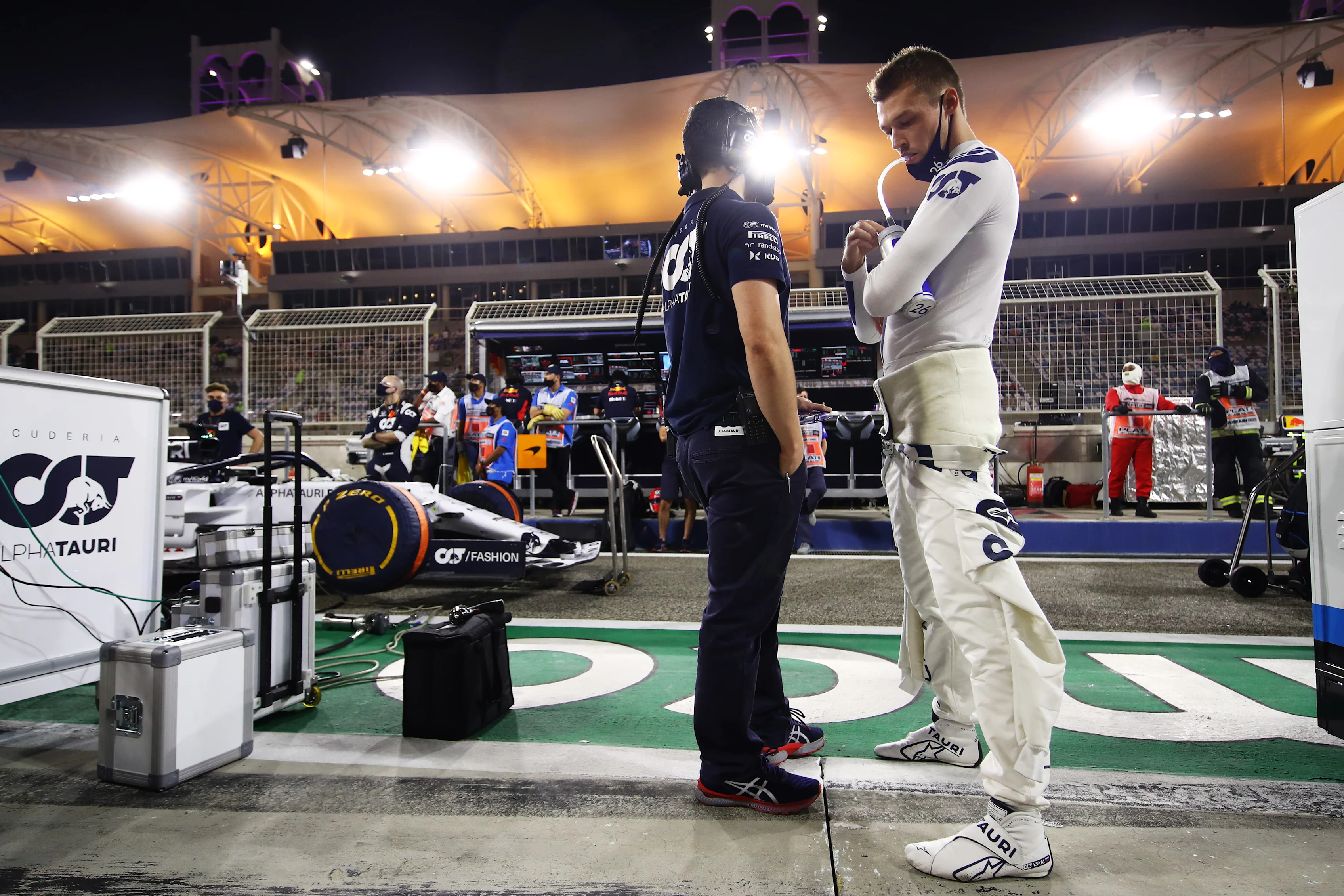 BAHRAIN, BAHRAIN - NOVEMBER 29: Daniil Kvyat of Russia and Scuderia AlphaTauri talks with an