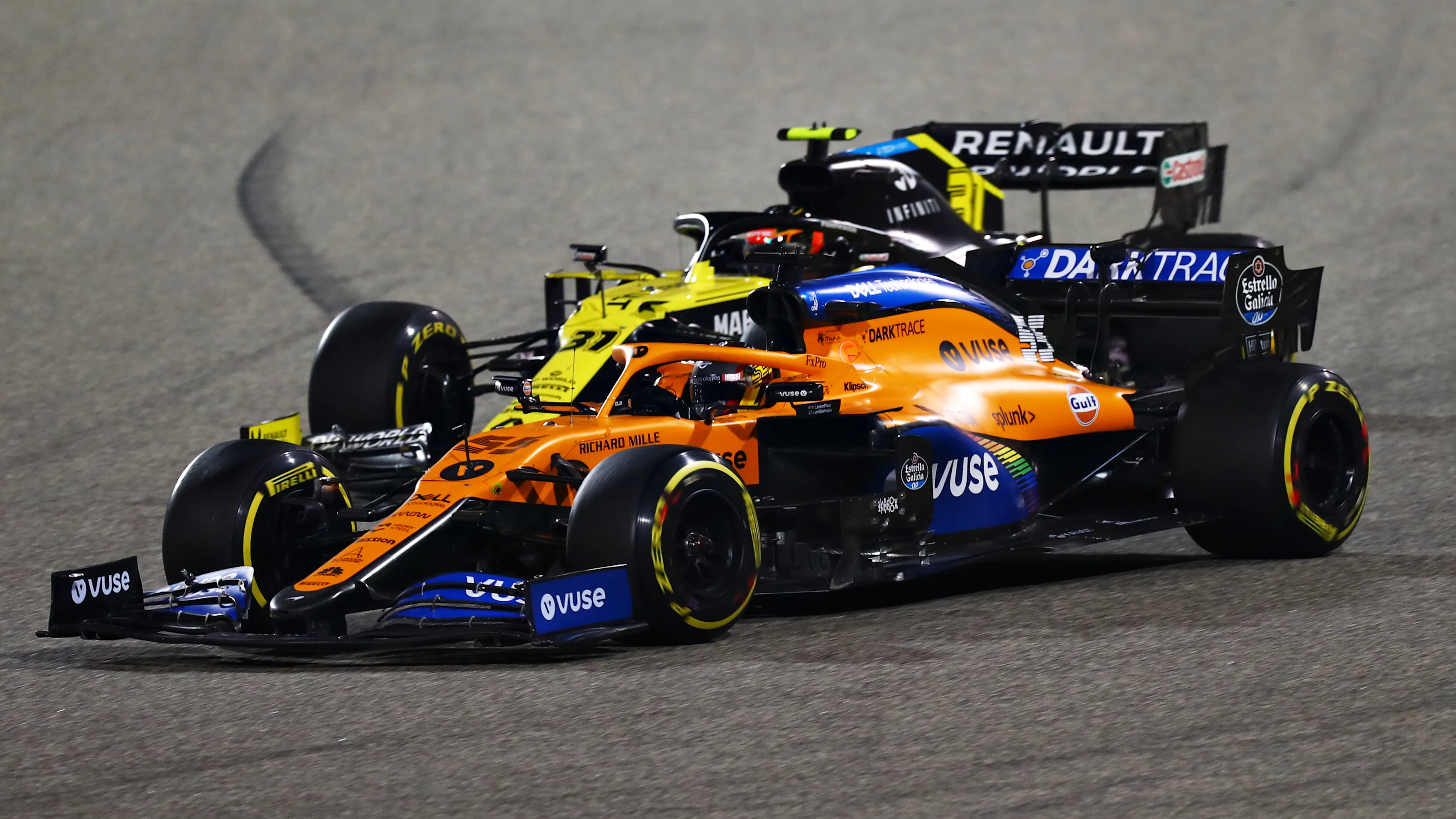BAHRAIN, BAHRAIN - NOVEMBER 29: Carlos Sainz of Spain driving the (55) McLaren F1 Team MCL35 Renault leads Esteban Ocon of France driving the (31) Renault Sport Formula One Team RS20 during the F1 Grand Prix of Bahrain at Bahrain International Circuit on November 29, 2020 in Bahrain, Bahrain. (Photo by Dan Istitene - Formula 1/Formula 1 via Getty Images)
