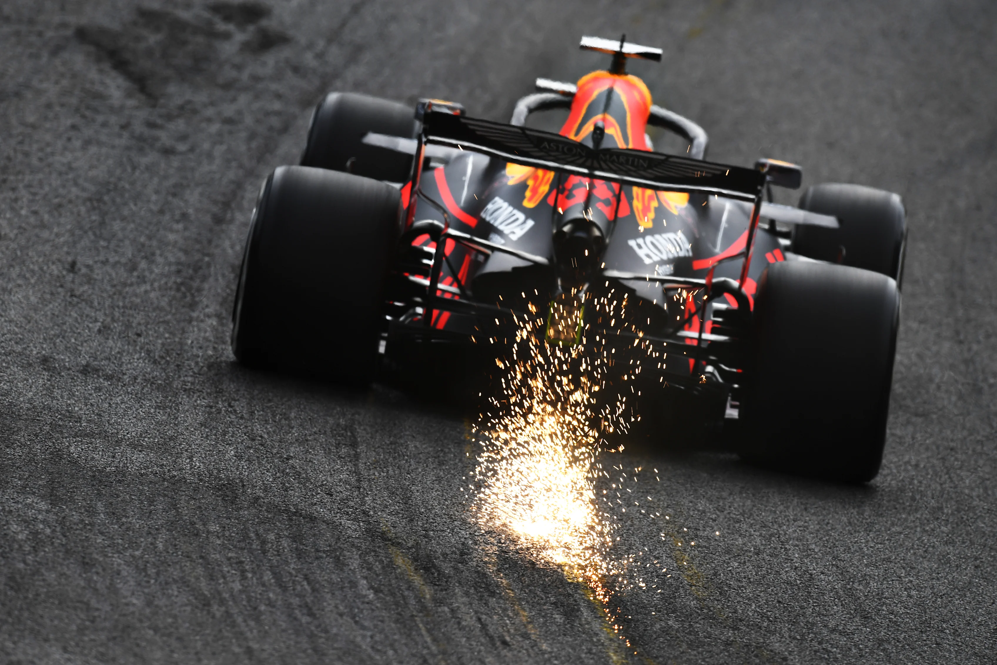 SPA, BELGIUM - AUGUST 28: Sparks fly behind Max Verstappen of the Netherlands driving the (33)