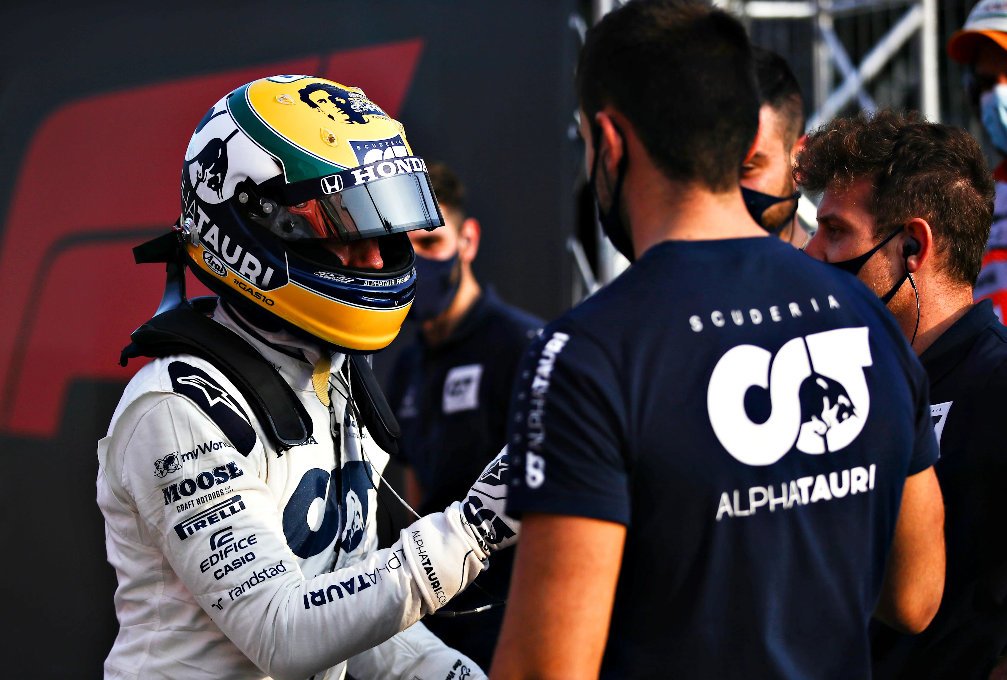 IMOLA, ITALY - OCTOBER 31: Pierre Gasly of France and Scuderia AlphaTauri shakes hands with a