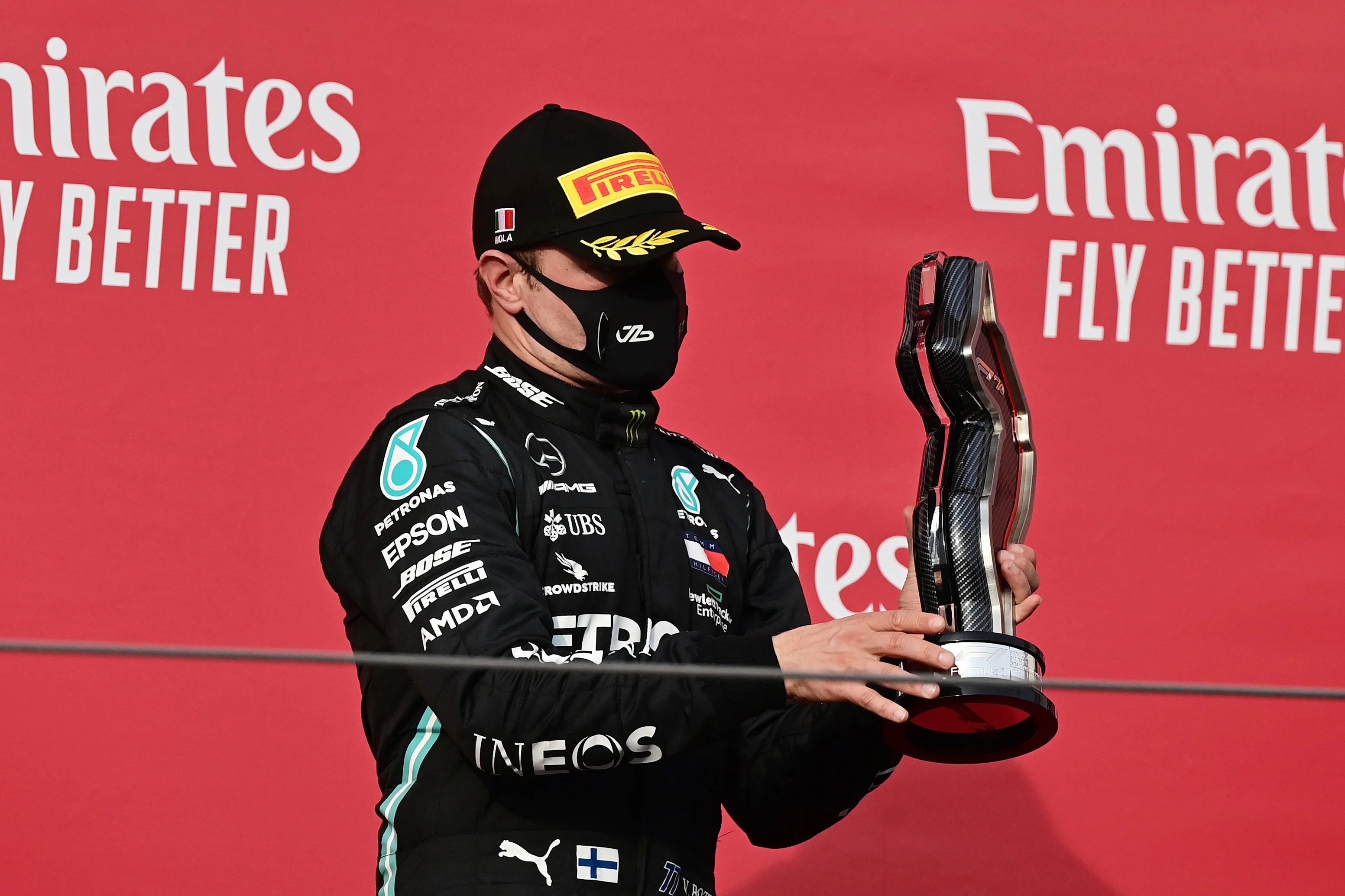 IMOLA, ITALY - NOVEMBER 01: Second place Valtteri Bottas of Finland and Mercedes GP celebrates on the podium during the F1 Grand Prix of Emilia Romagna at Autodromo Enzo e Dino Ferrari on November 01, 2020 in Imola, Italy. (Photo by Miguel Medina - Pool/Getty Images)
