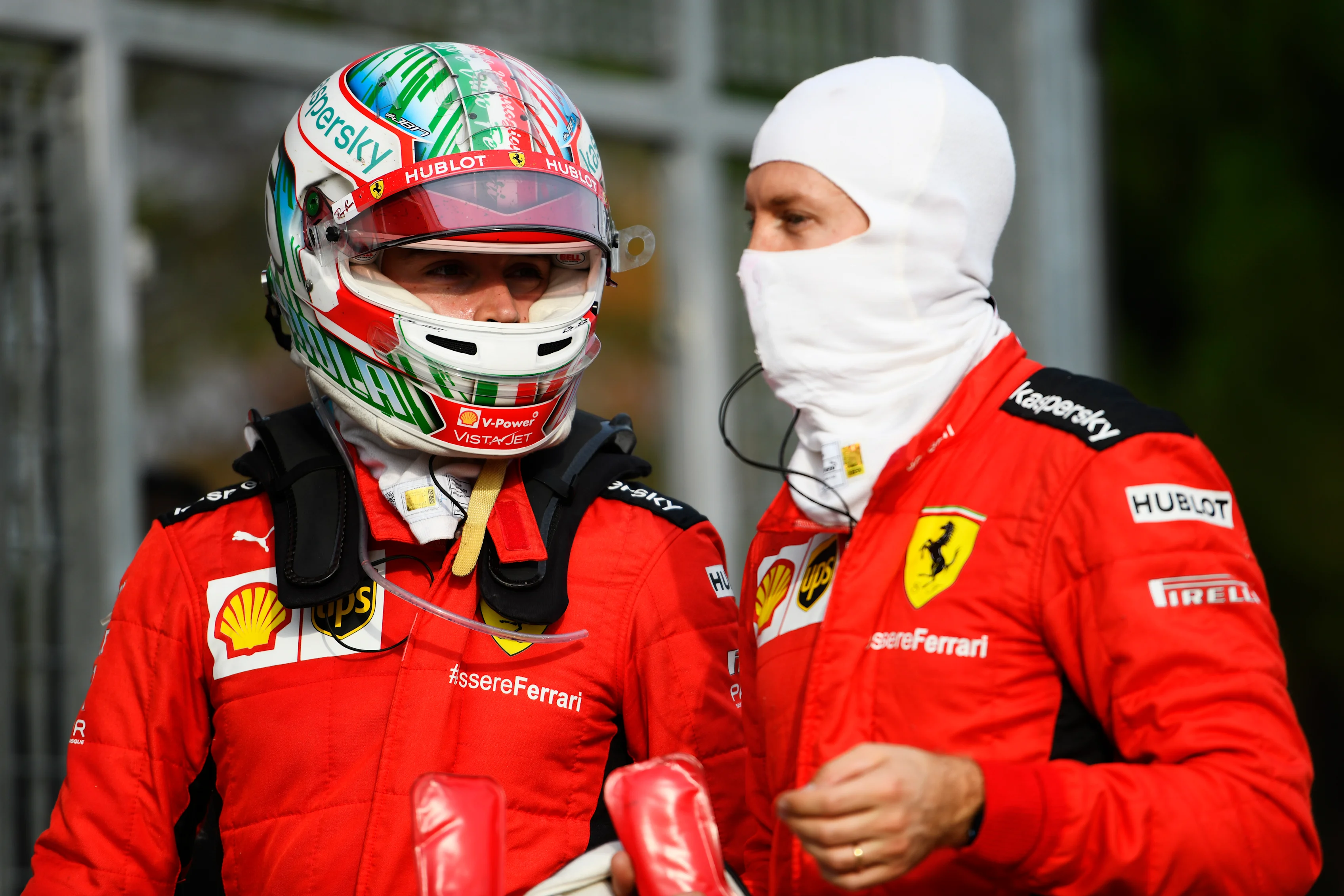 IMOLA, ITALY - NOVEMBER 01: Charles Leclerc of Monaco and Ferrari speaks with teammate Sebastian