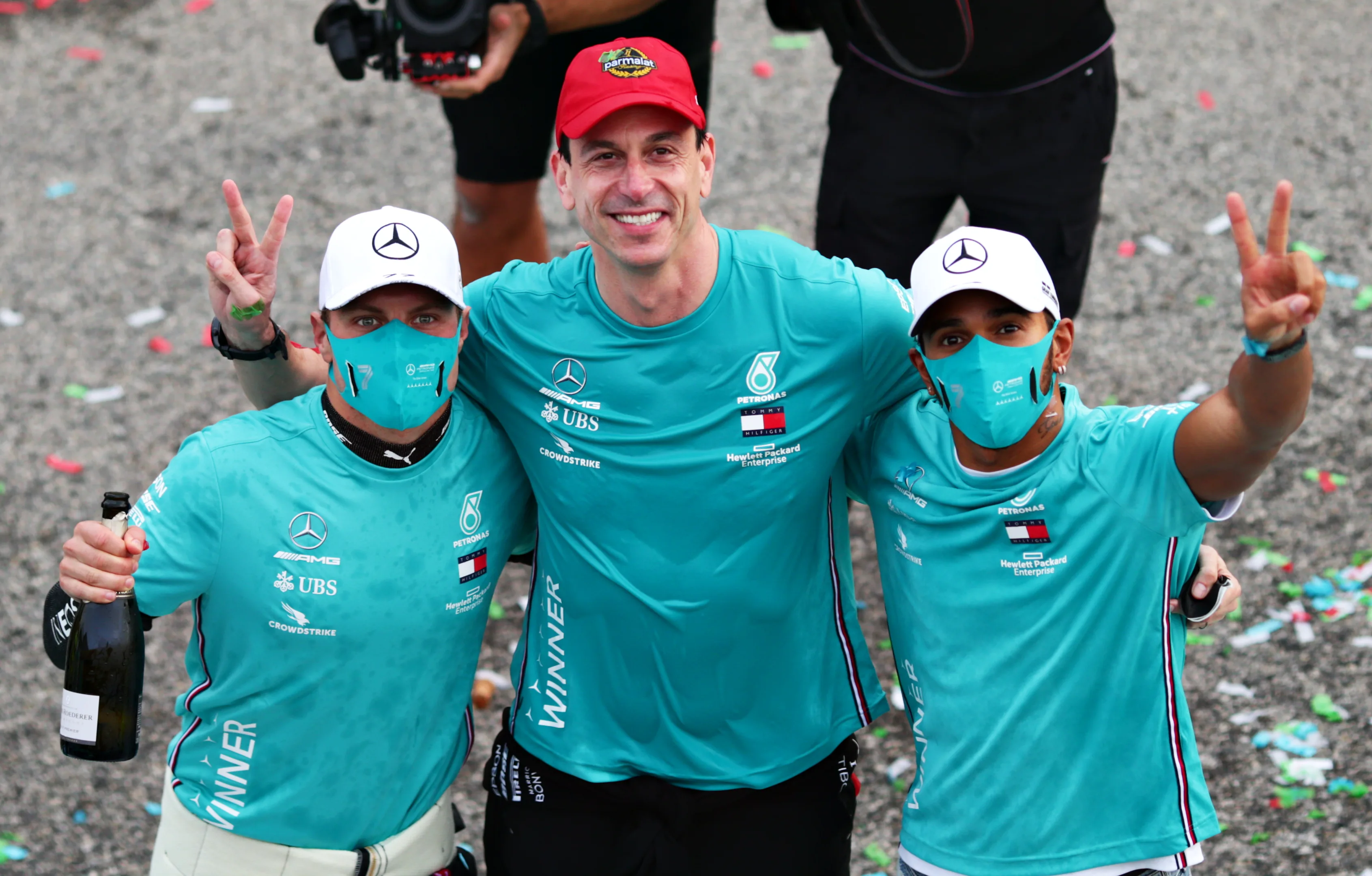 IMOLA, ITALY - NOVEMBER 01: Race winner Lewis Hamilton of Great Britain and Mercedes GP, second placed Valtteri Bottas of Finland and Mercedes GP and Mercedes GP Executive Director Toto Wolff celebrate after the Mercedes GP team won a 7th consecutive F1 Constructors Championship during the F1 Grand Prix of Emilia Romagna at Autodromo Enzo e Dino Ferrari on November 01, 2020 in Imola, Italy. (Photo by Peter Fox/Getty Images)