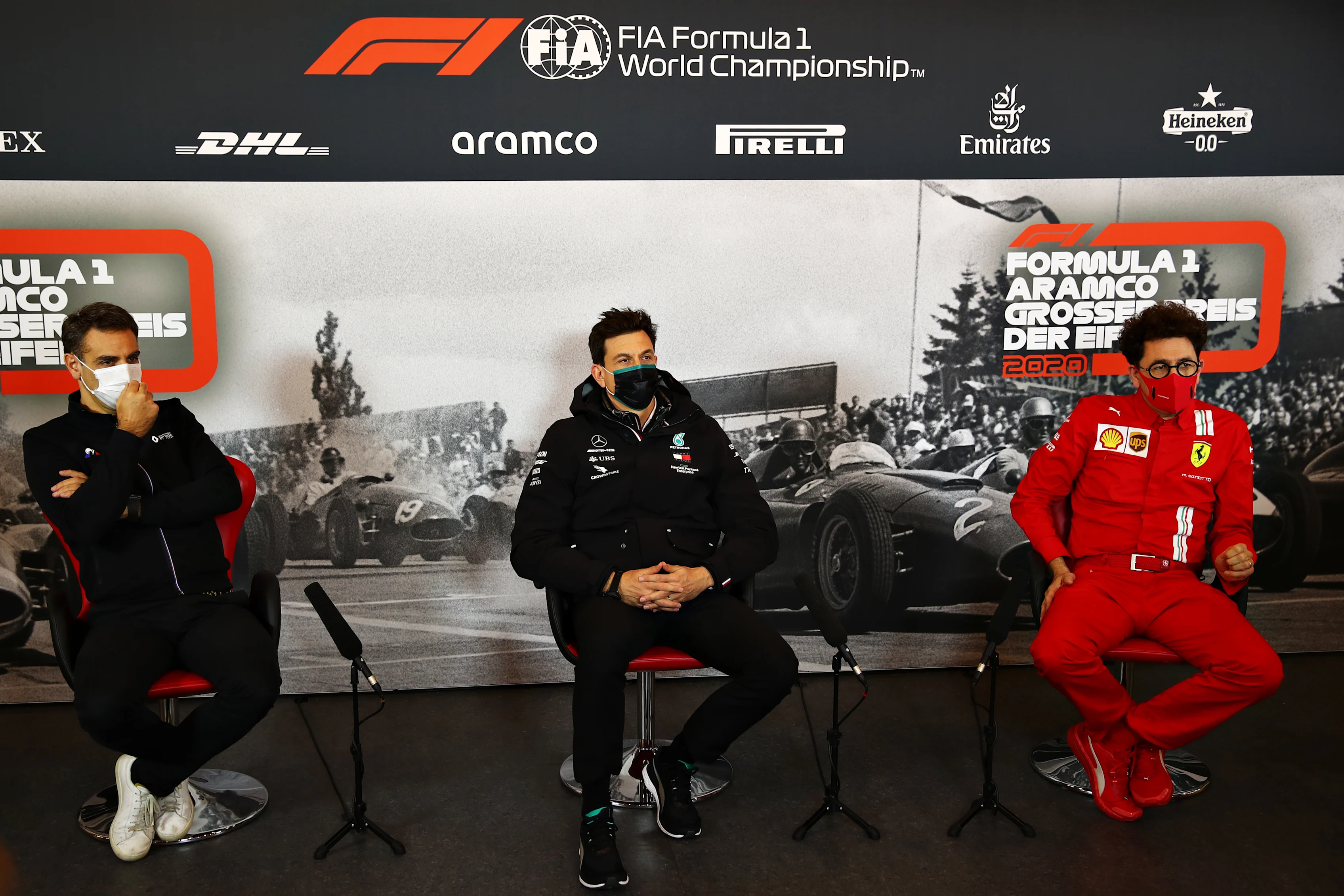 NUERBURG, GERMANY - OCTOBER 09: (L-R) Renault Sport F1 Managing Director Cyril Abiteboul, Mercedes GP Executive Director Toto Wolff and Scuderia Ferrari Team Principal Mattia Binotto talk in the Team Principals Press Conference during practice ahead of the F1 Eifel Grand Prix at Nuerburgring on October 09, 2020 in Nuerburg, Germany. (Photo by Joe Portlock/Getty Images)