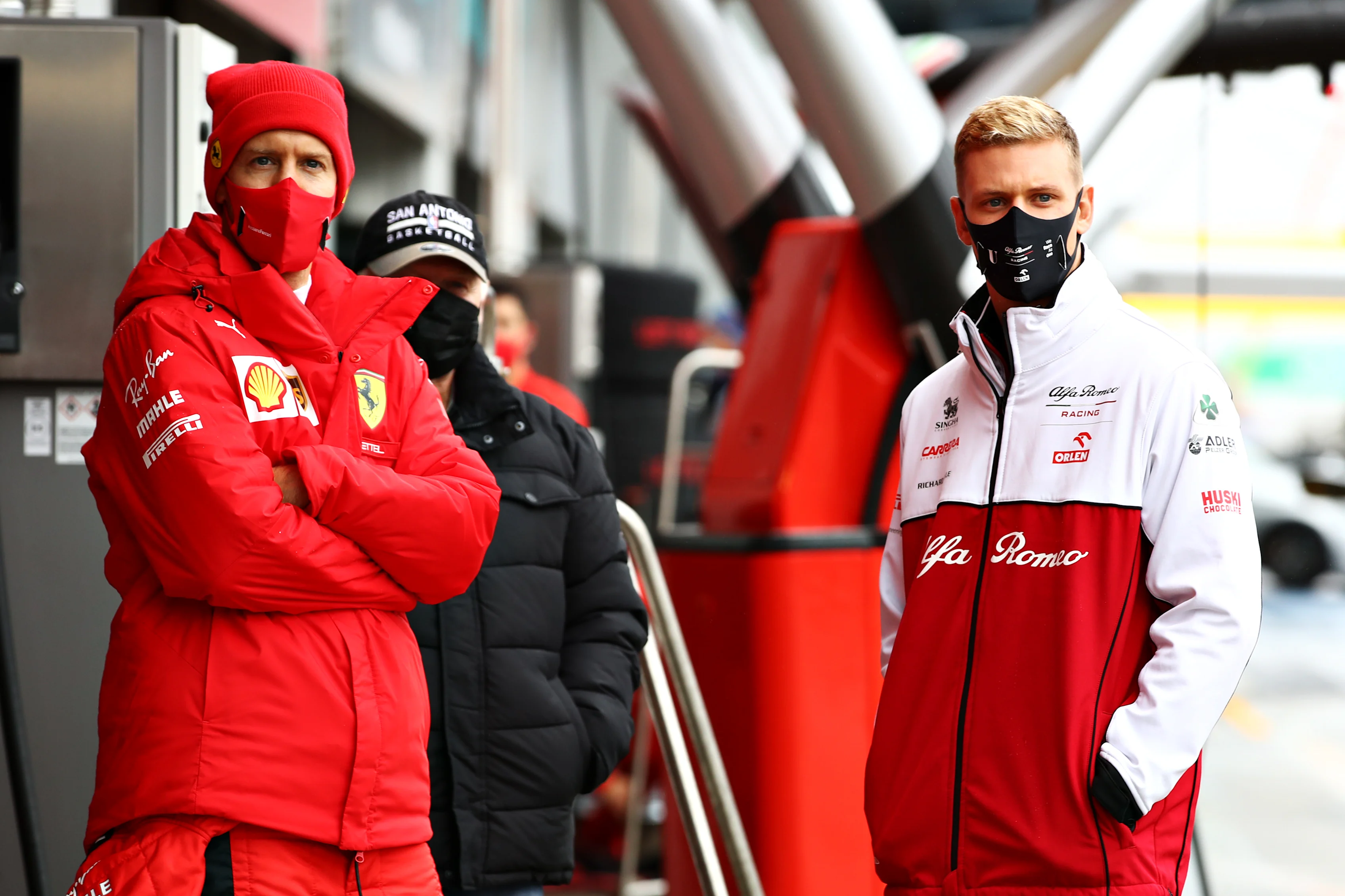 NUERBURG, GERMANY - OCTOBER 09: Sebastian Vettel of Germany and Ferrari and Mick Schumacher of