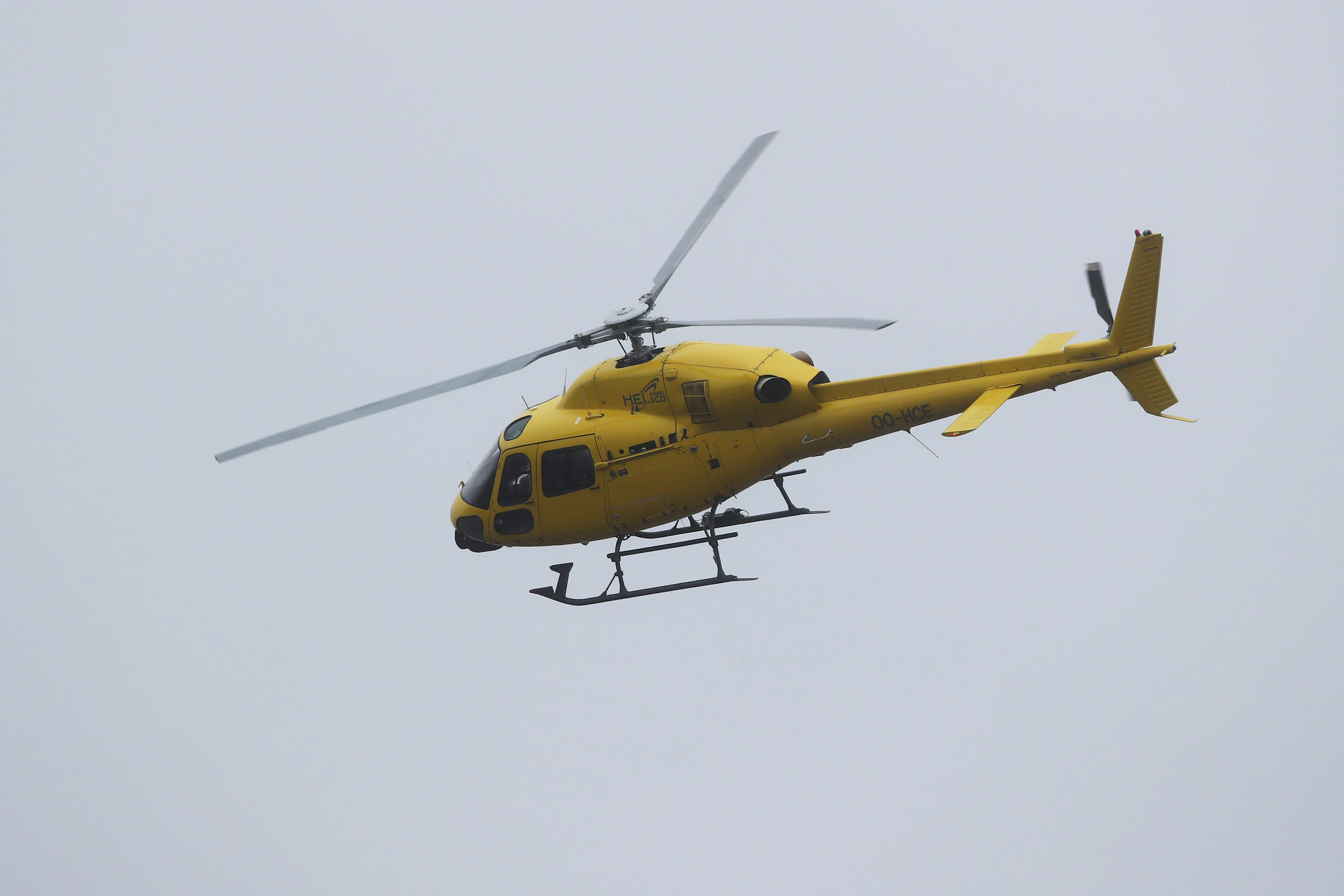 NUERBURG, GERMANY - OCTOBER 09: The TV helicopter flies over the circuit during practice ahead of