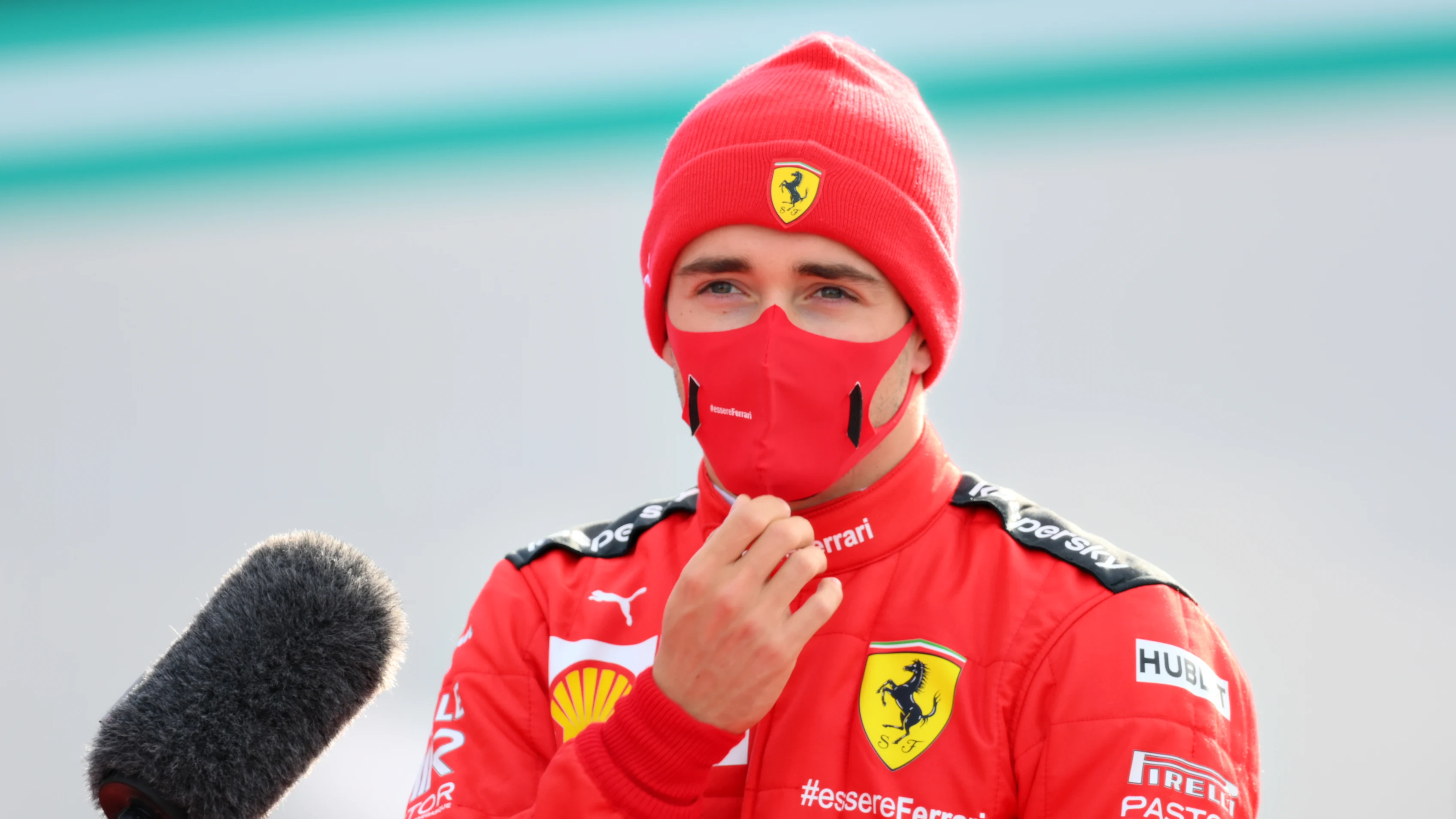 NUERBURG, GERMANY - OCTOBER 10: Charles Leclerc of Monaco and Ferrari talks to the media in the