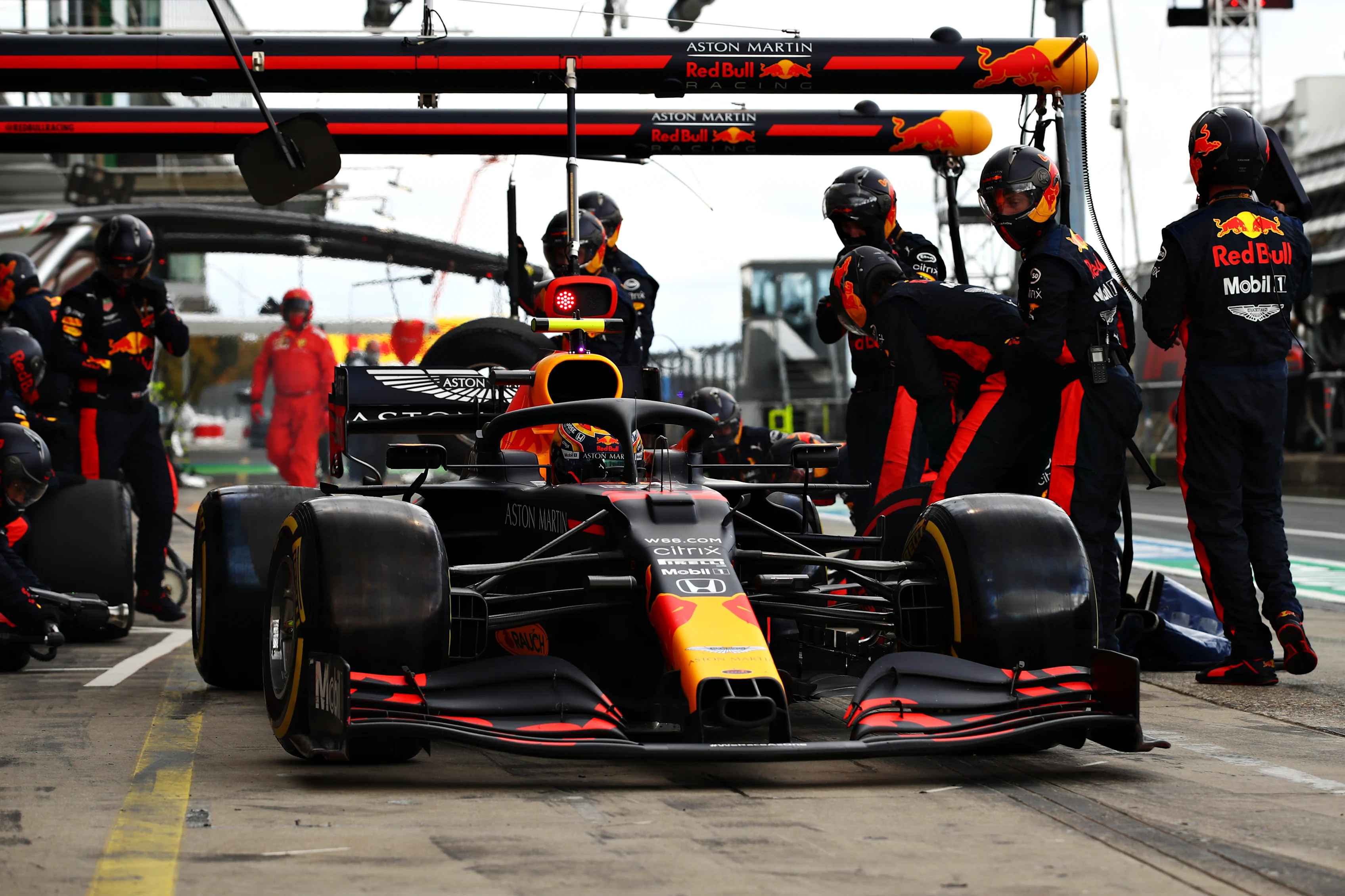 NUERBURG, GERMANY - OCTOBER 11: Alexander Albon of Thailand driving the (23) Aston Martin Red Bull Racing RB16 comes in for a tyre change during the F1 Eifel Grand Prix at Nuerburgring on October 11, 2020 in Nuerburg, Germany. (Photo by Mark Thompson/Getty Images)