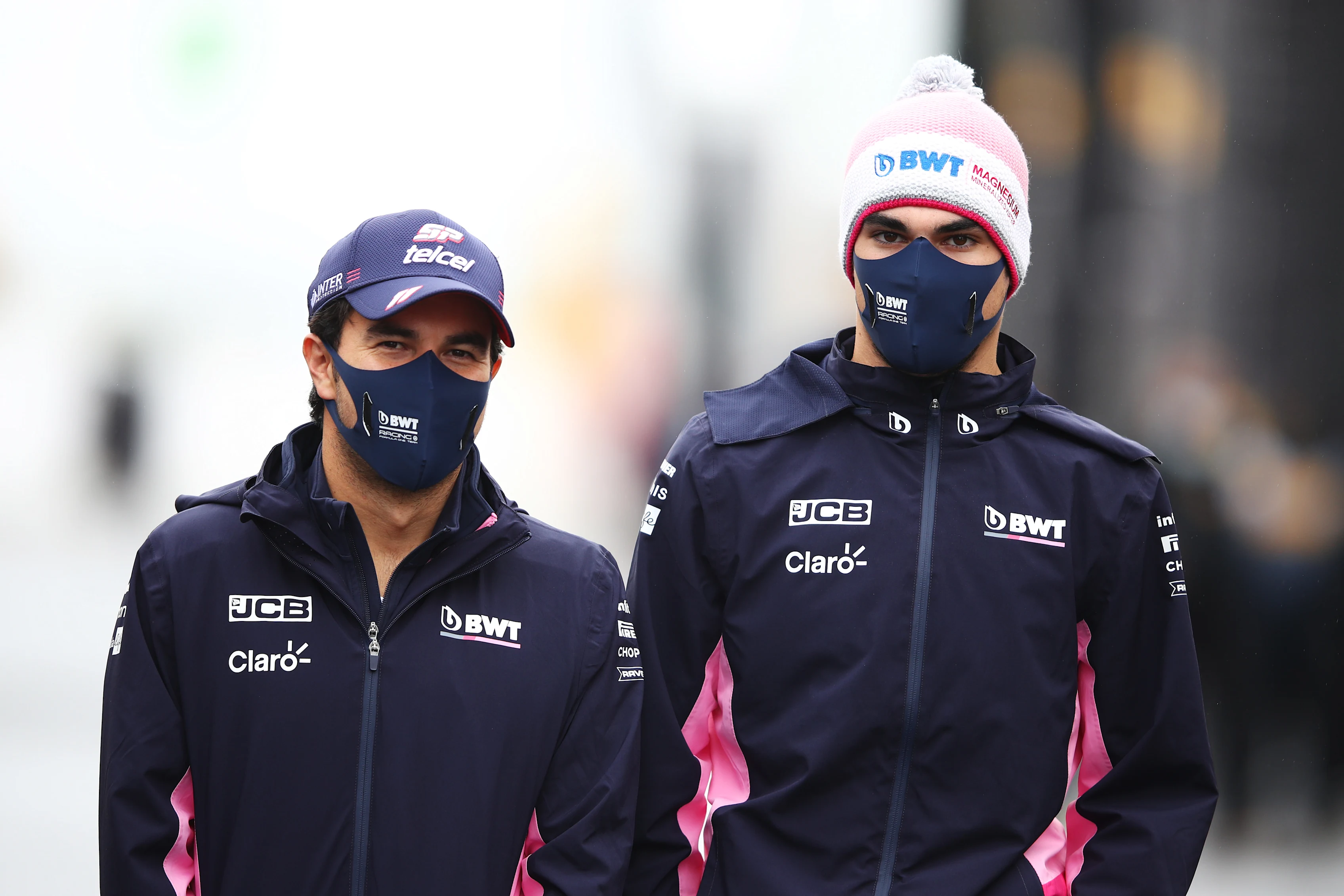 NUERBURG, GERMANY - OCTOBER 08: Lance Stroll of Canada and Racing Point and Sergio Perez of Mexico