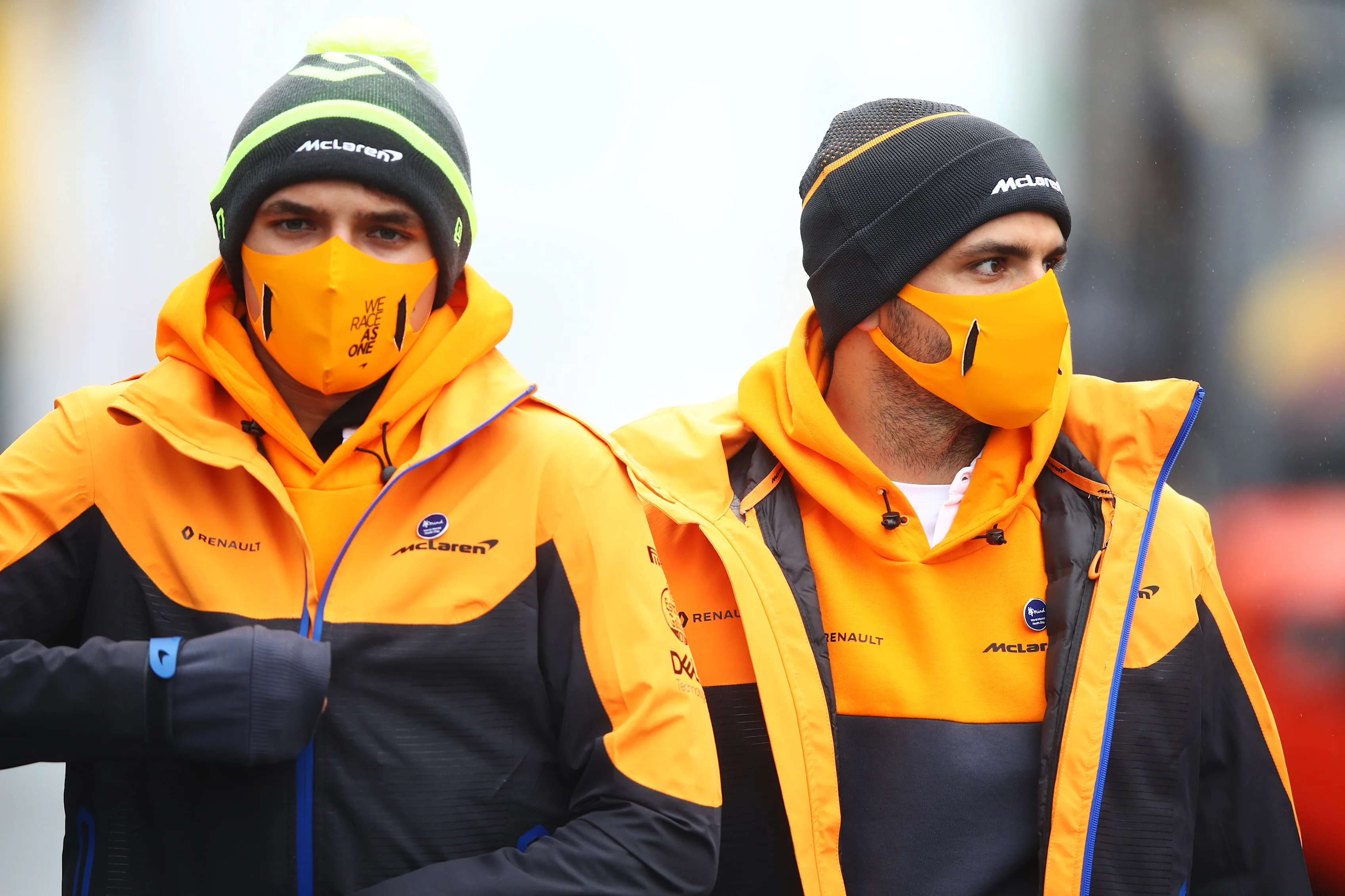 NUERBURG, GERMANY - OCTOBER 08: Lando Norris of Great Britain and McLaren F1 and Carlos Sainz of Spain and McLaren F1 walk in the Paddock during previews ahead of the F1 Eifel Grand Prix at Nuerburgring on October 08, 2020 in Nuerburg, Germany. (Photo by Mark Thompson/Getty Images)