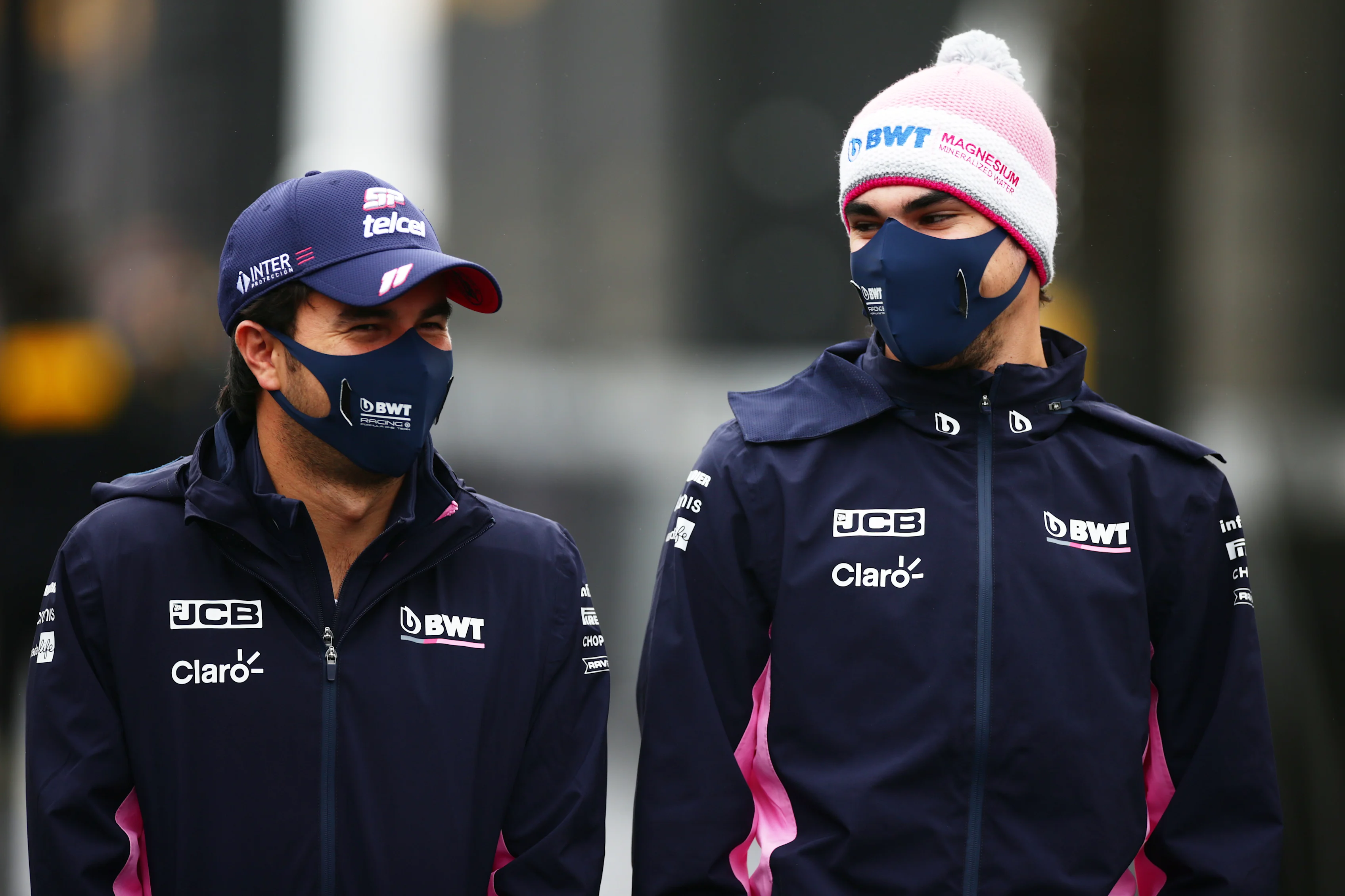 NUERBURG, GERMANY - OCTOBER 08: Lance Stroll of Canada and Racing Point and Sergio Perez of Mexico