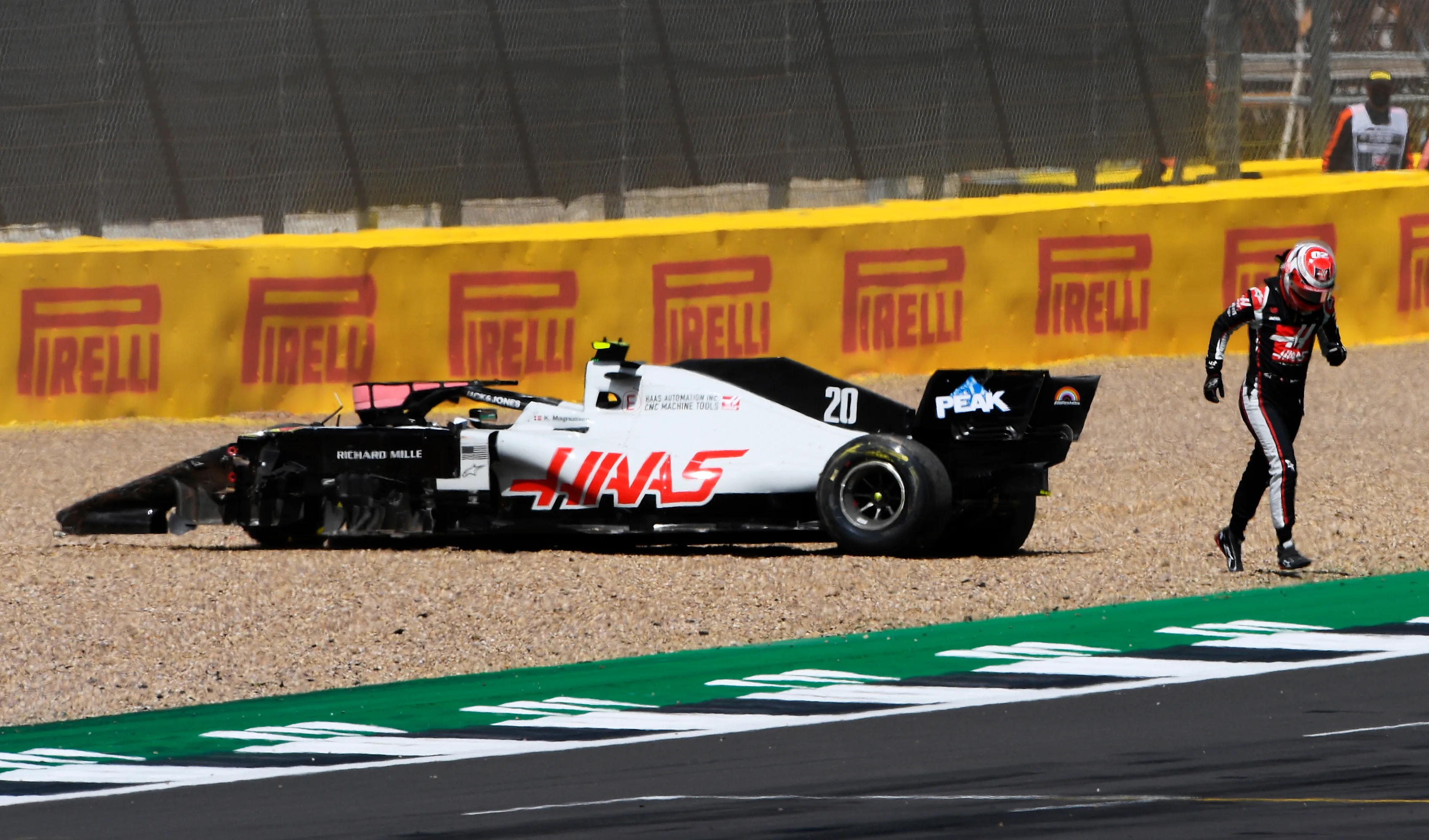 NORTHAMPTON, ENGLAND - AUGUST 02:  Kevin Magnussen of Denmark driving the (20) Haas F1 Team VF-20 Ferrari leaves his car after spinning off during the F1 Grand Prix of Great Britain at Silverstone on August 02, 2020 in Northampton, England. (Photo by Rudy Carezzevoli/Getty Images)