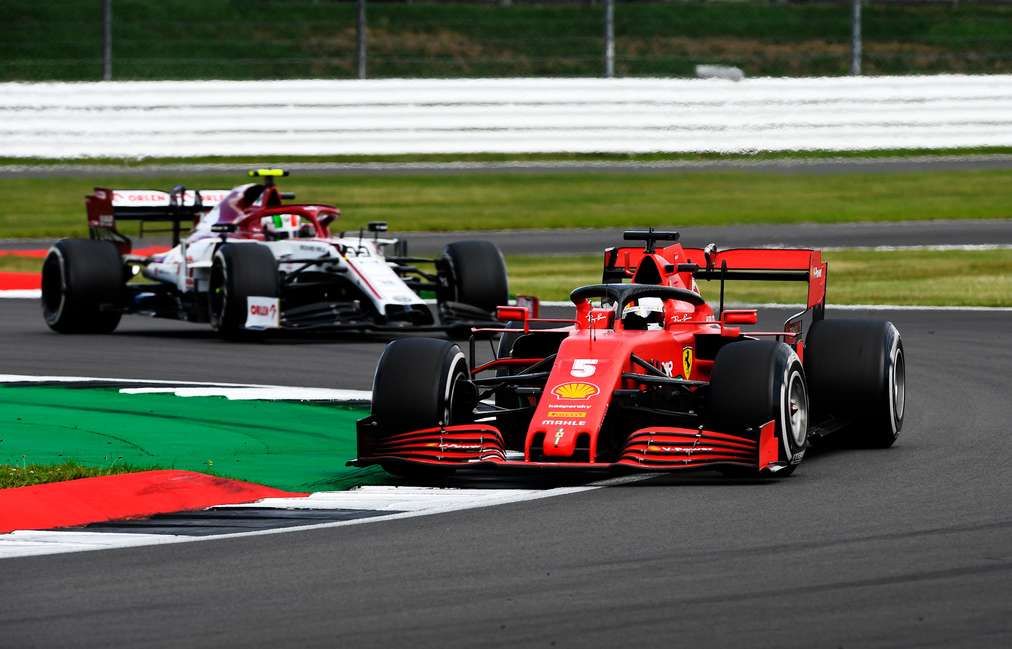 NORTHAMPTON, ENGLAND - AUGUST 02: Sebastian Vettel of Germany driving the (5) Scuderia Ferrari