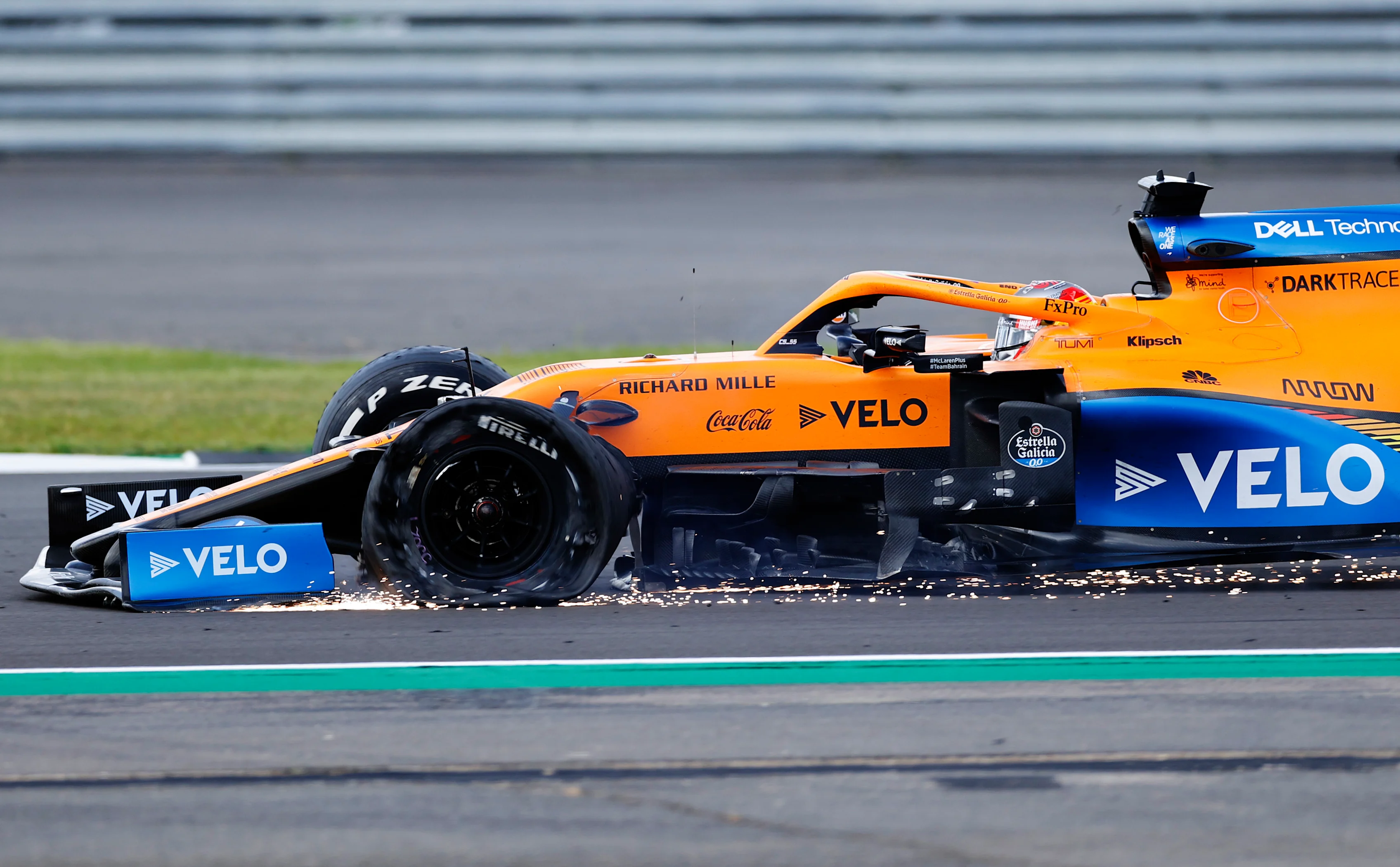 NORTHAMPTON, ENGLAND - AUGUST 02: Carlos Sainz of Spain driving the (55) McLaren F1 Team MCL35