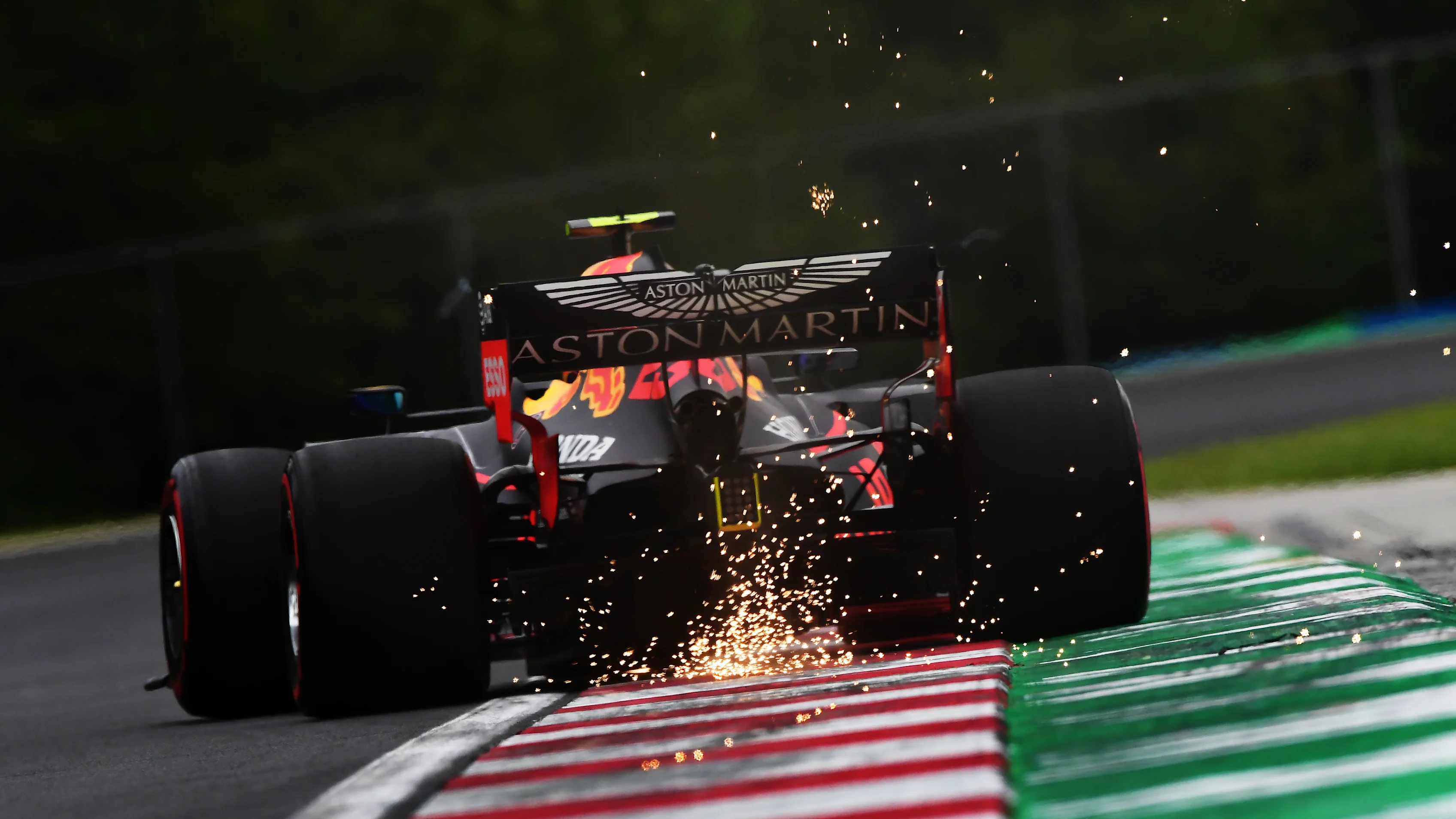 BUDAPEST, HUNGARY - JULY 17: Sparks fly behind Alexander Albon of Thailand driving the (23) Aston