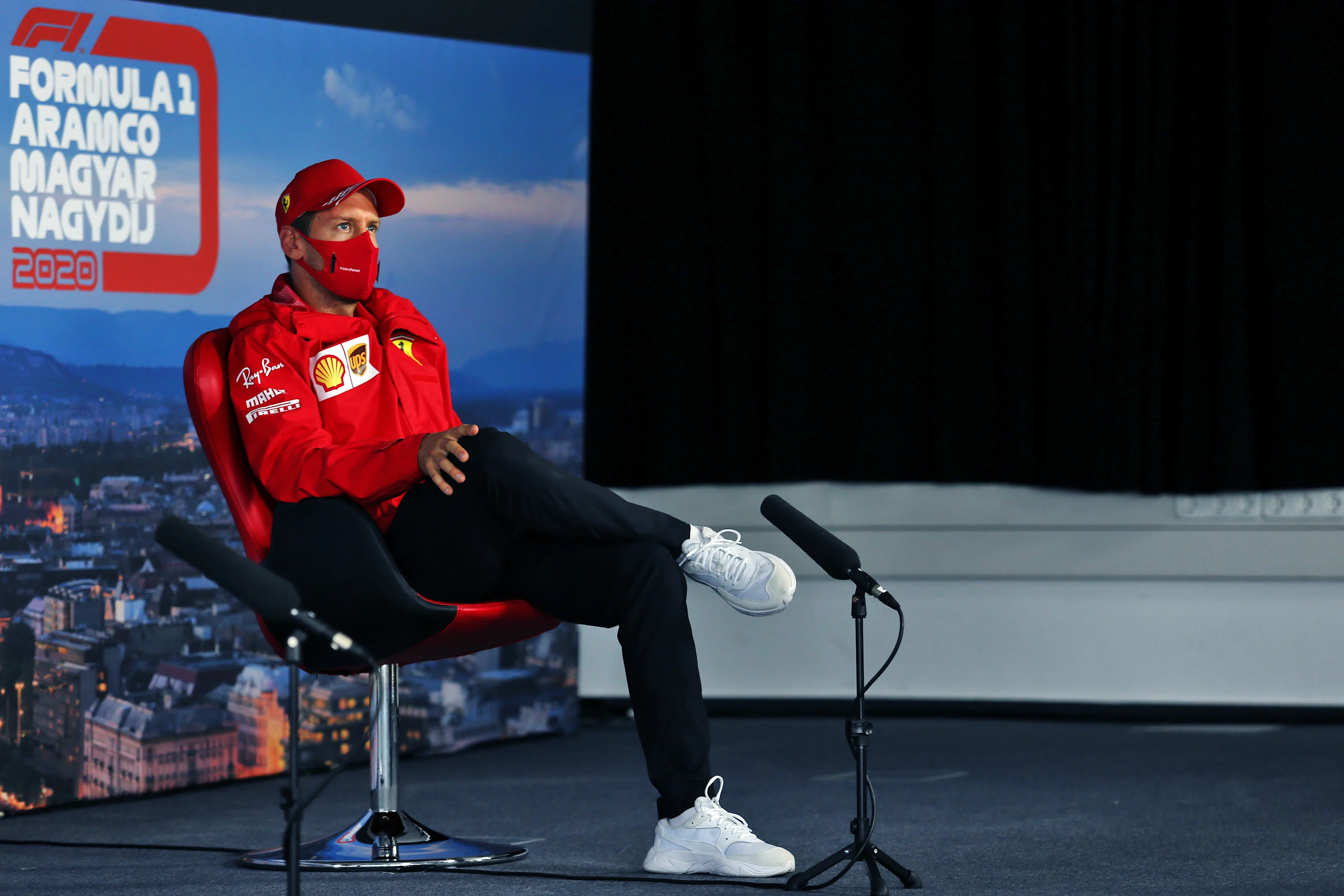BUDAPEST, HUNGARY - JULY 16: Sebastian Vettel of Germany and Ferrari talks in the Drivers Press