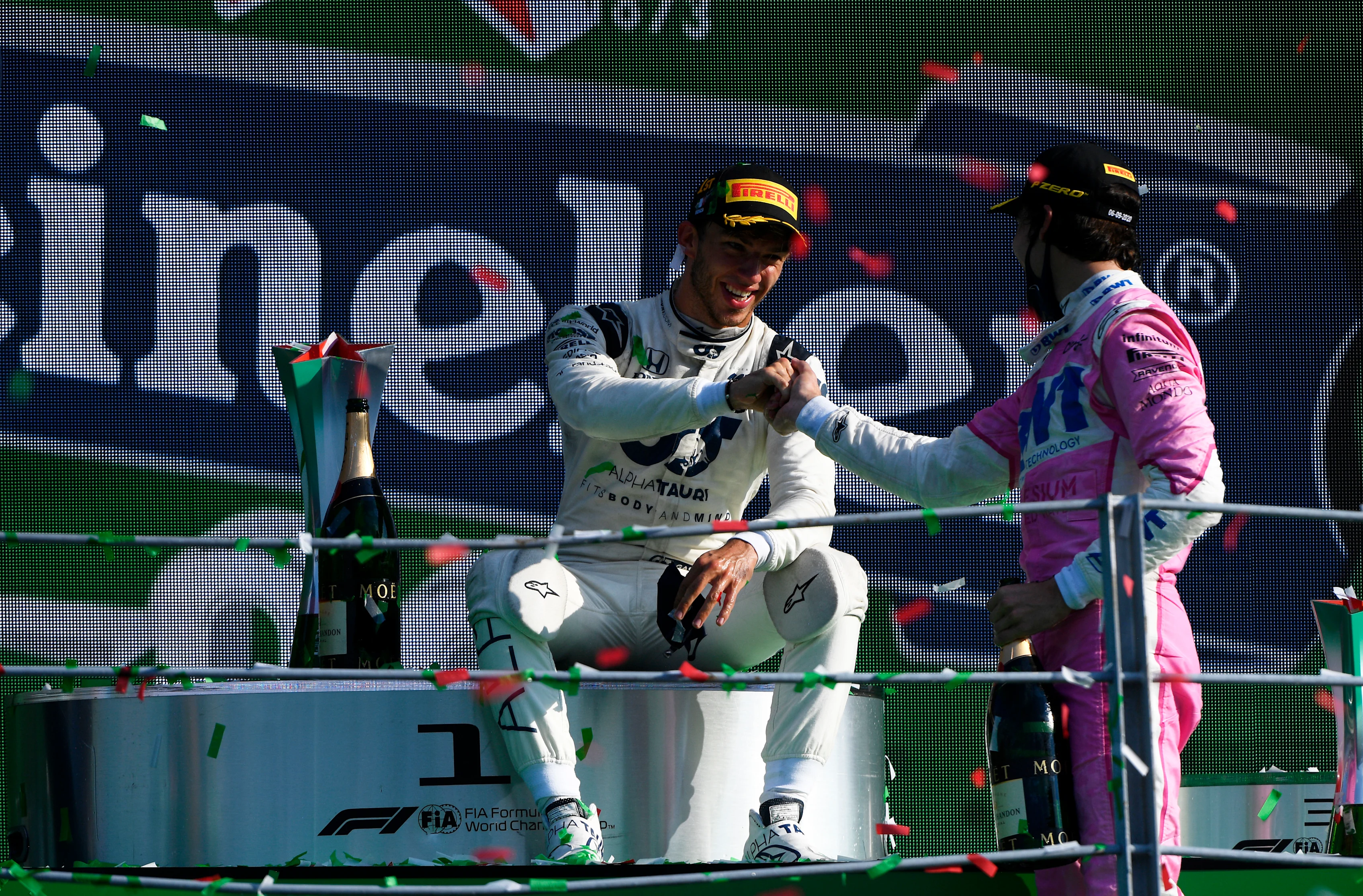 MONZA, ITALY - SEPTEMBER 06: Race winner Pierre Gasly of France and Scuderia AlphaTauri is congratulated by third placed Lance Stroll of Canada and Racing Point during the F1 Grand Prix of Italy at Autodromo di Monza on September 06, 2020 in Monza, Italy. (Photo by Rudy Carezzevoli/Getty Images)